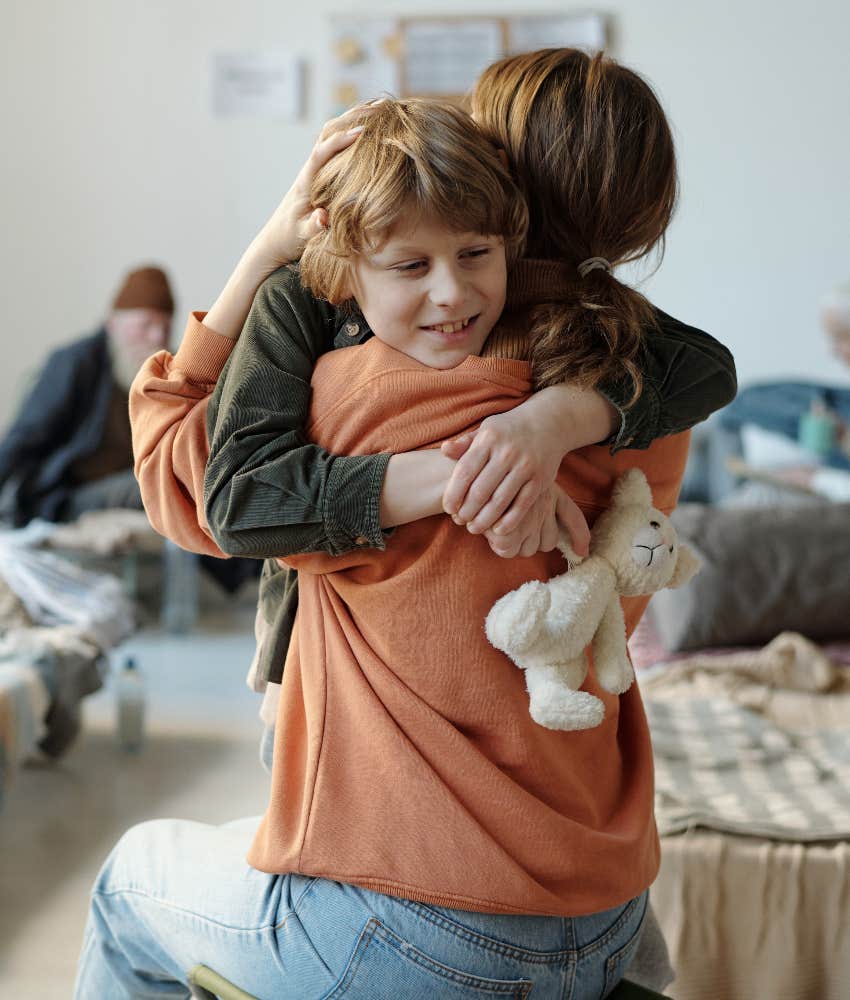 mom hugging child in shelter