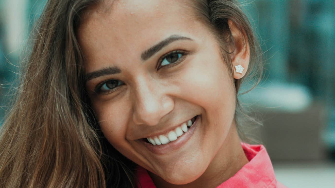 Woman is happy and unbothered.