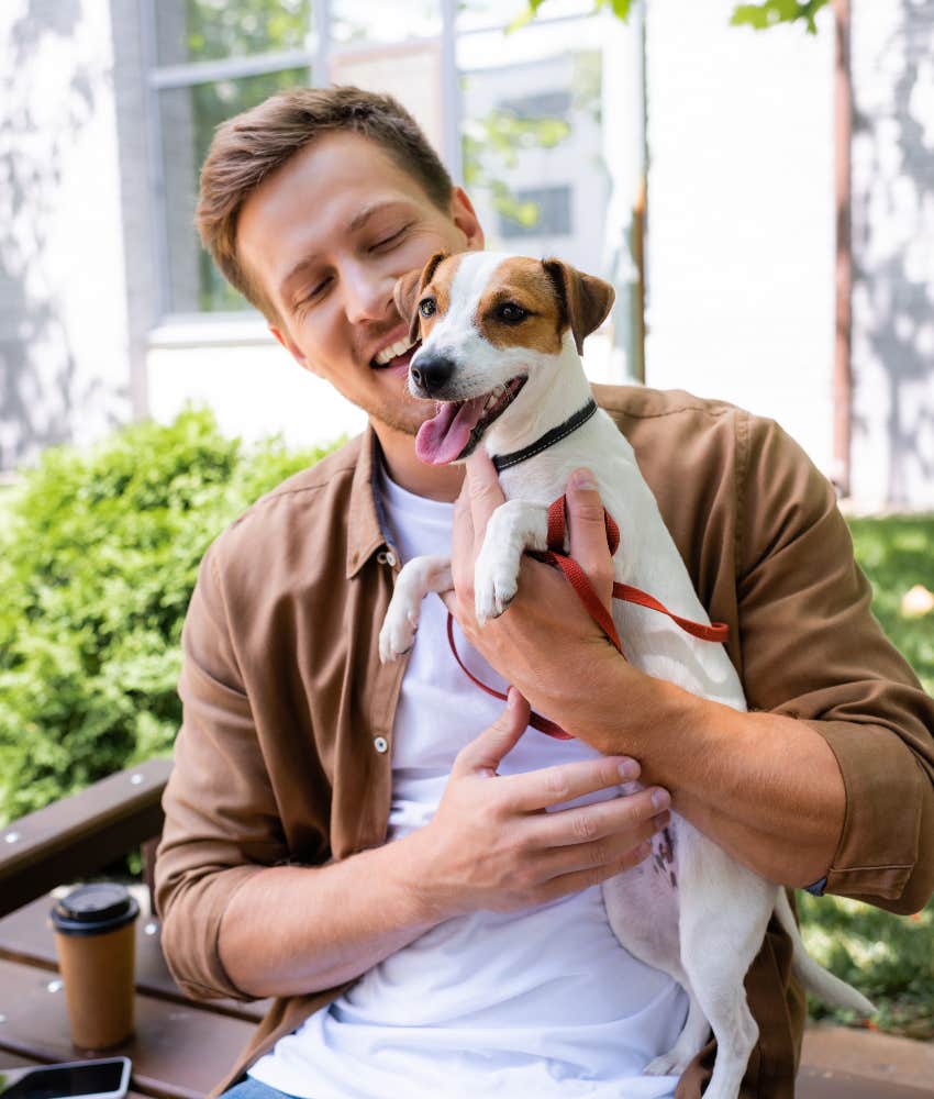man giving care to small dog