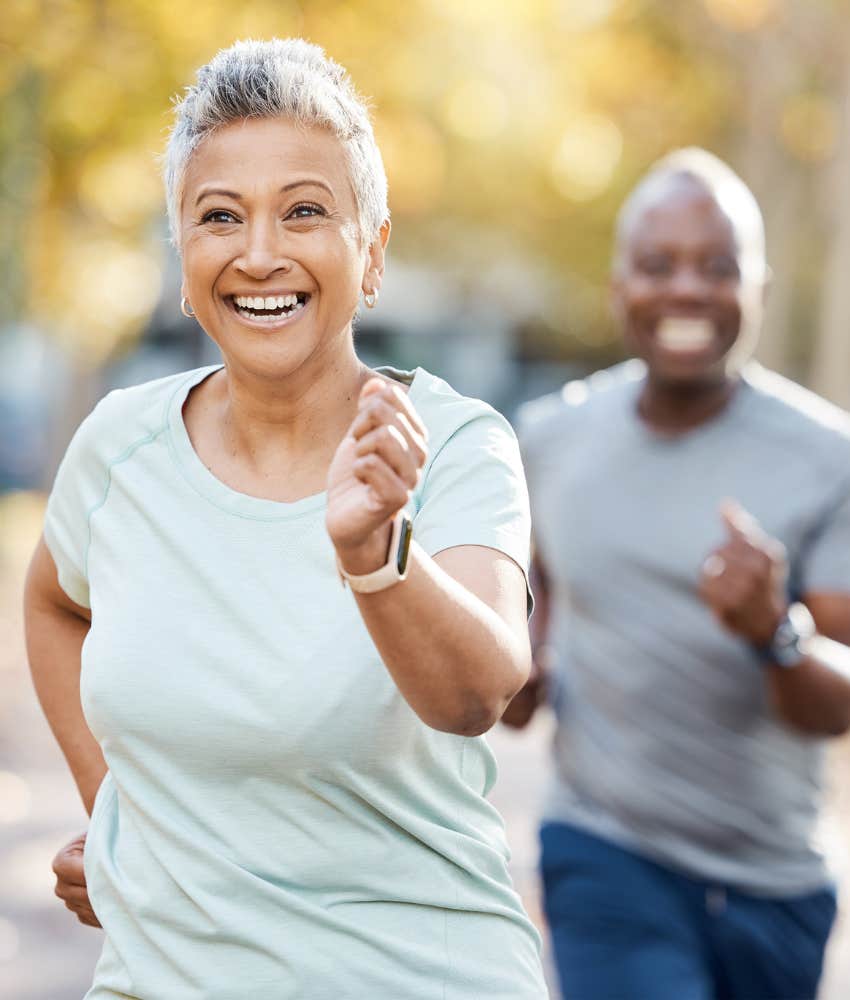 Happy older couple run showing importance of muscle mass in aging 
