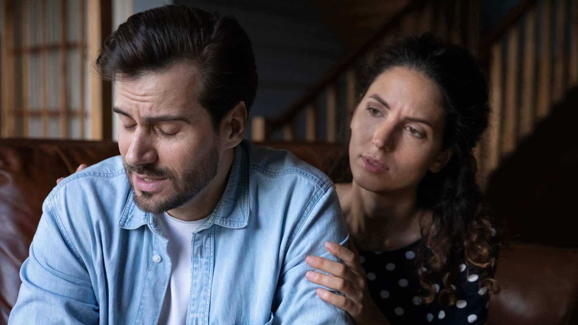 unhappy husband avoiding intimacy with wife
