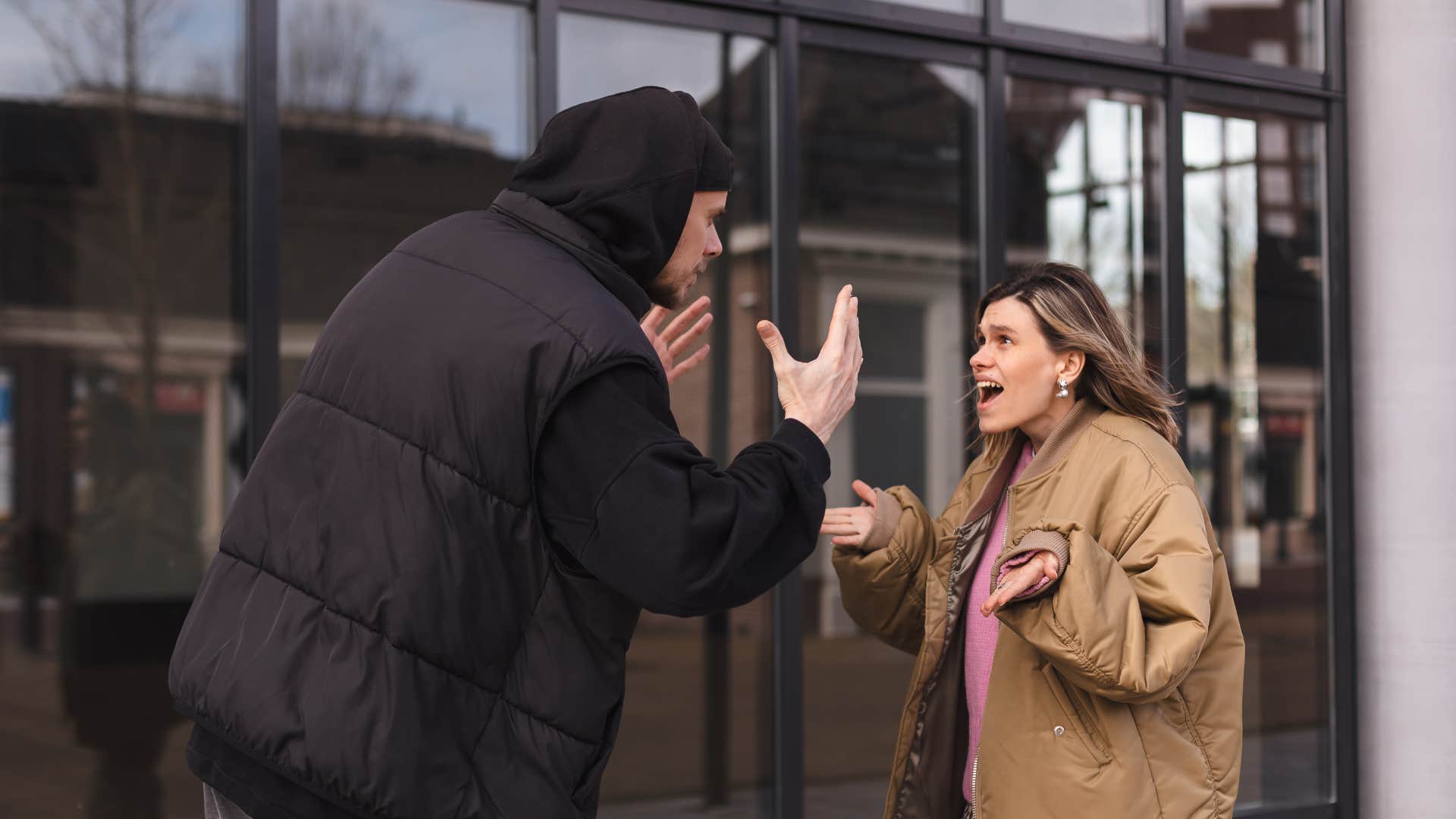 unhappy husband criticizing wife in public argument