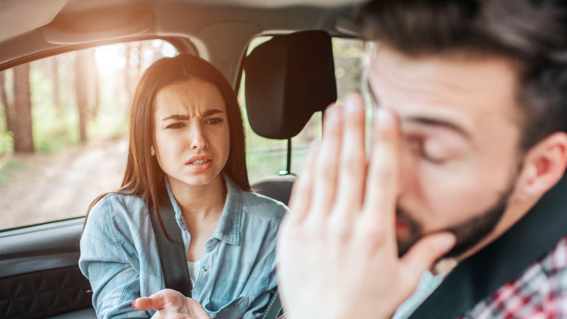 woman arguing with man as man stays silent during conflict