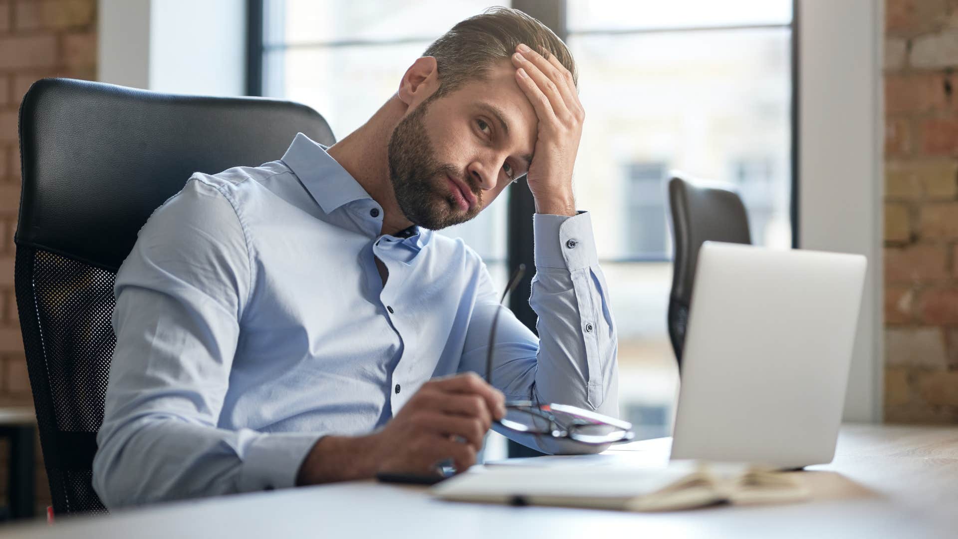 stressed man at work saying i never get a break 