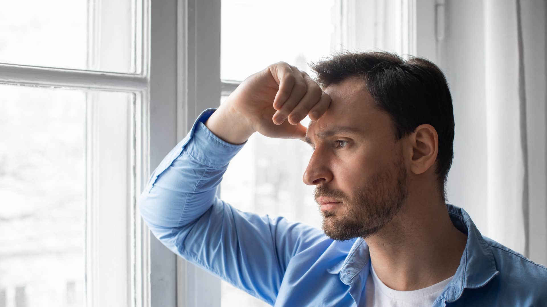 sad husband looking outside wondering whats the point