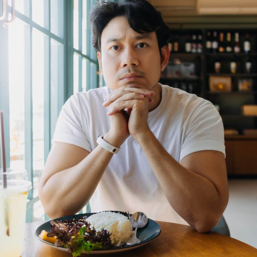 Man who starts eating alone in a restaurant