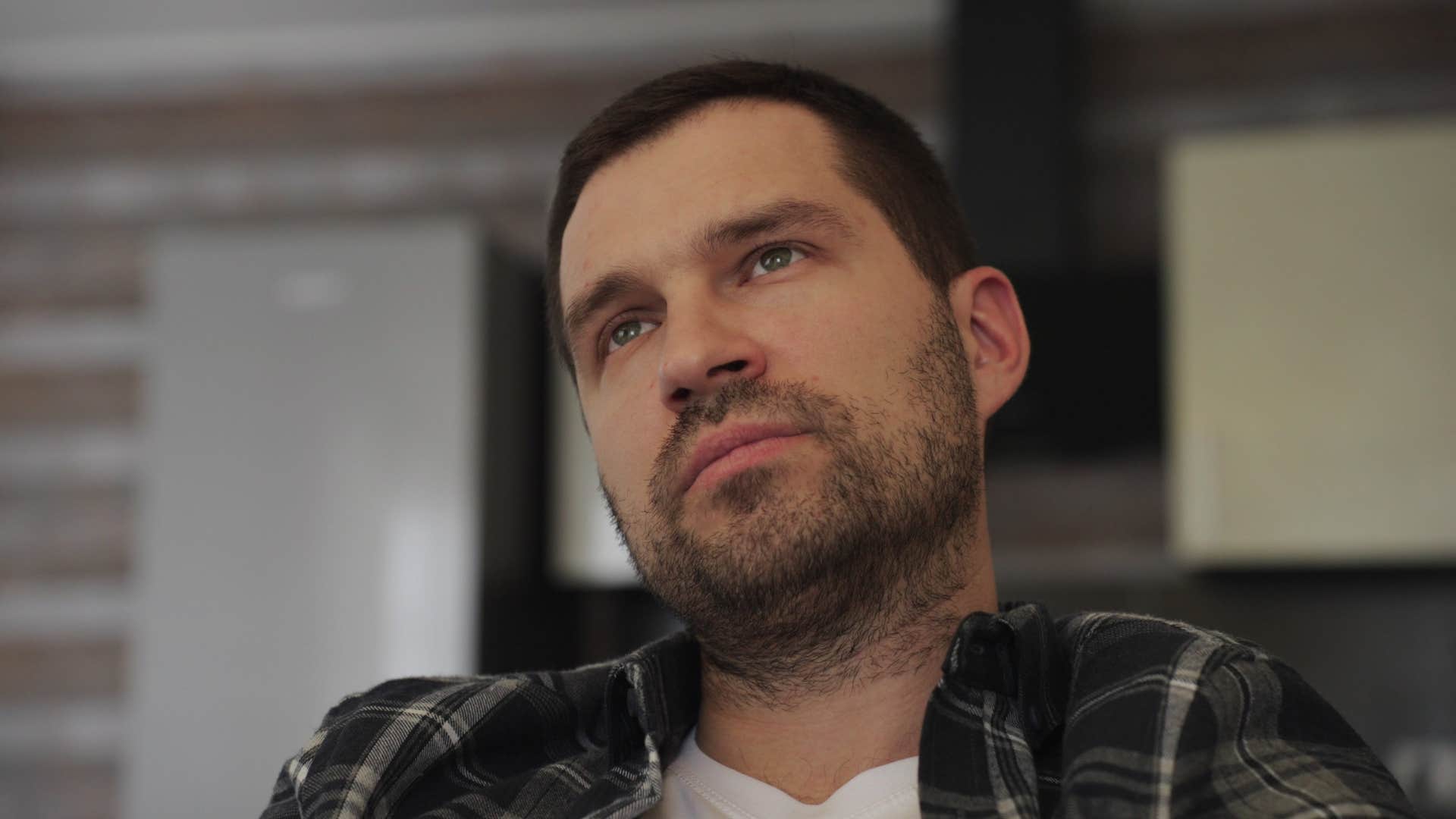 thoughtful man sitting at home