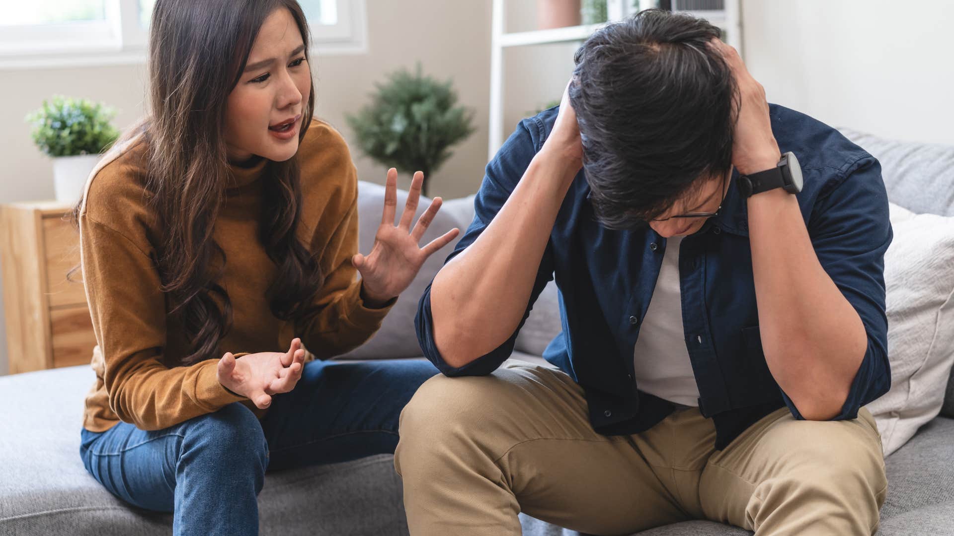 stressed man saying I'm not in the mood to his upset wife