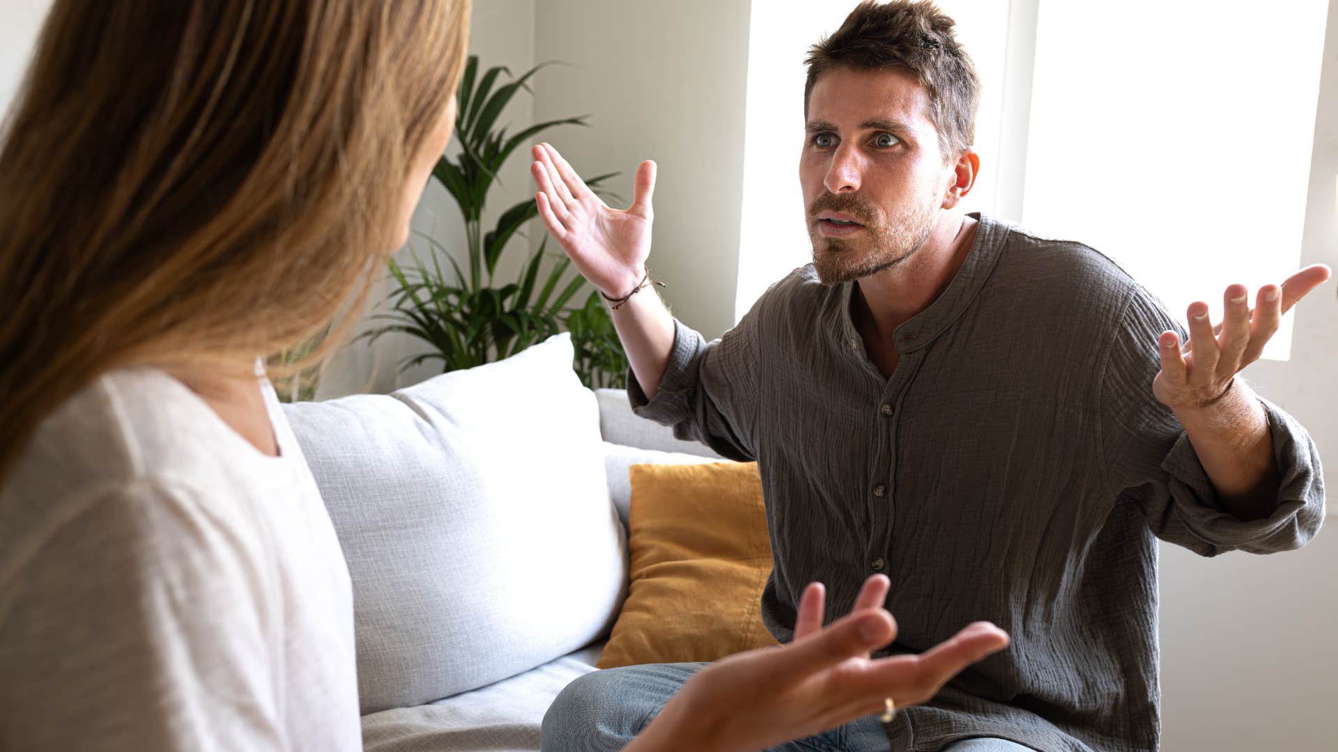 irate man saying it's not a big deal to his upset wife