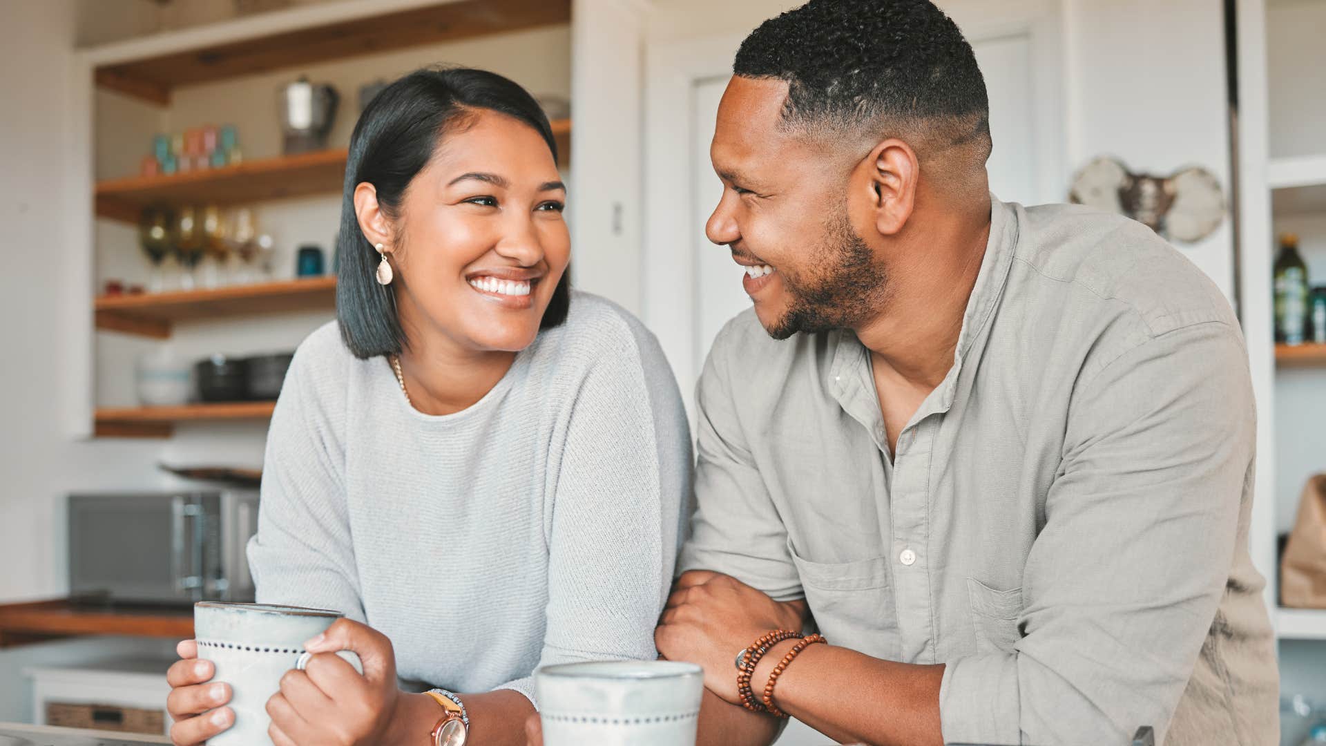 Man saying "I love you" to his wife at home.
