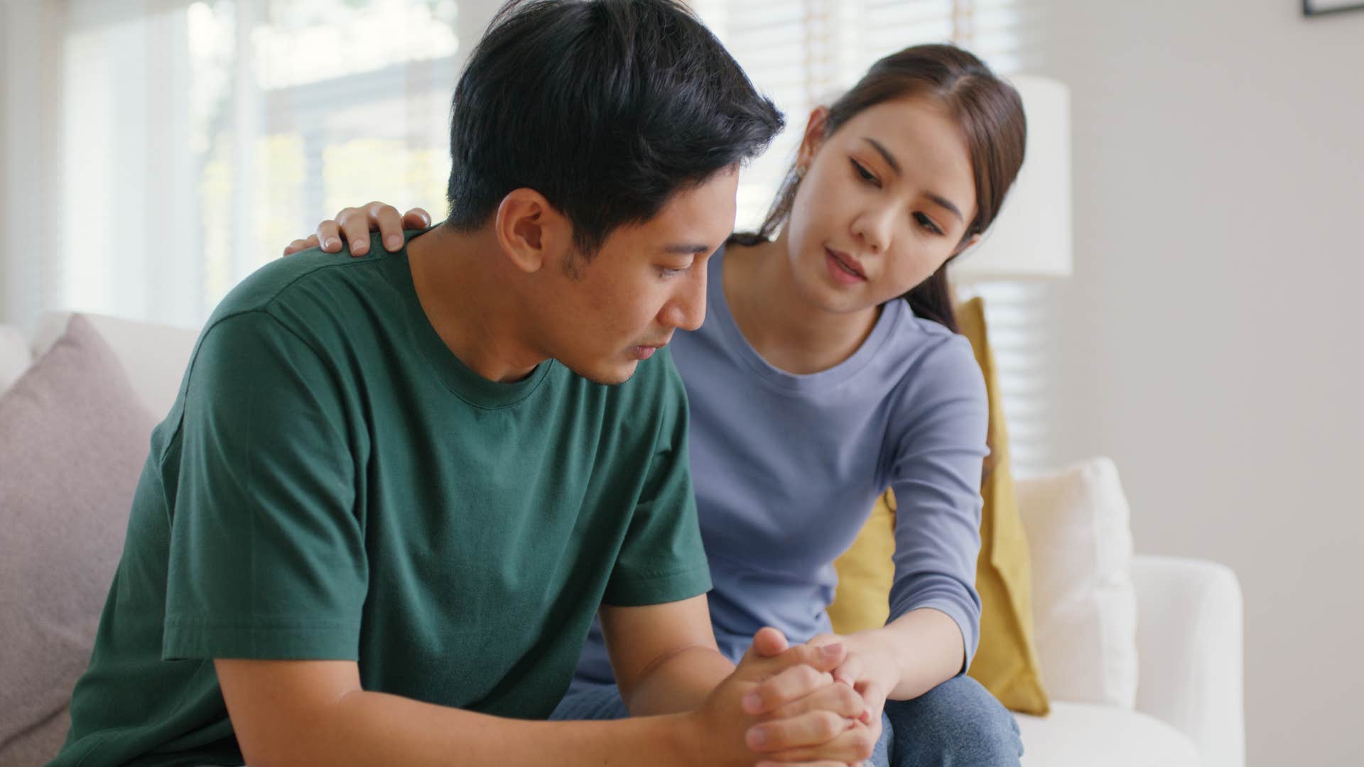 Man saying "I'm so sorry" to his wife.