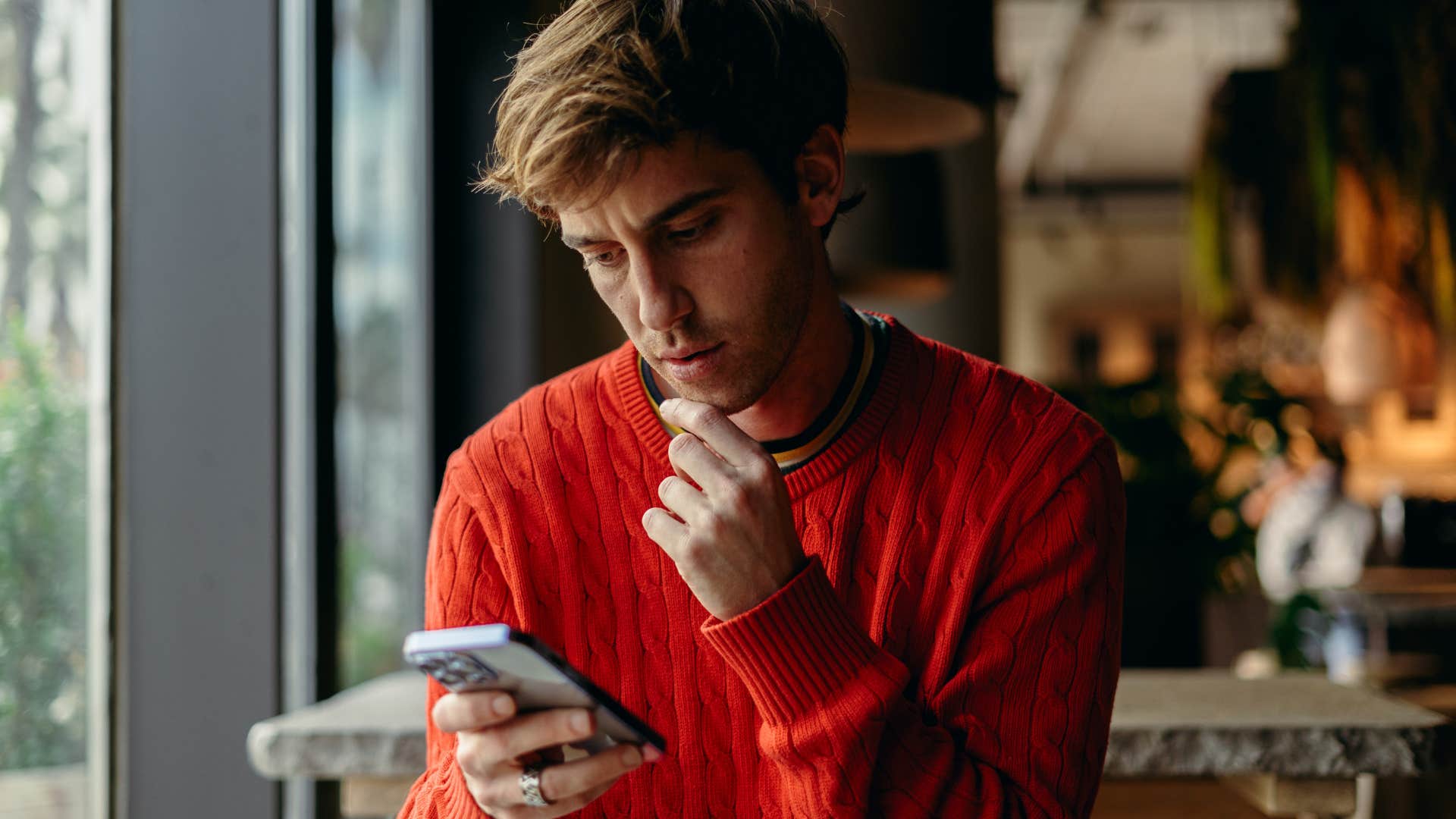 man reading text on his phone