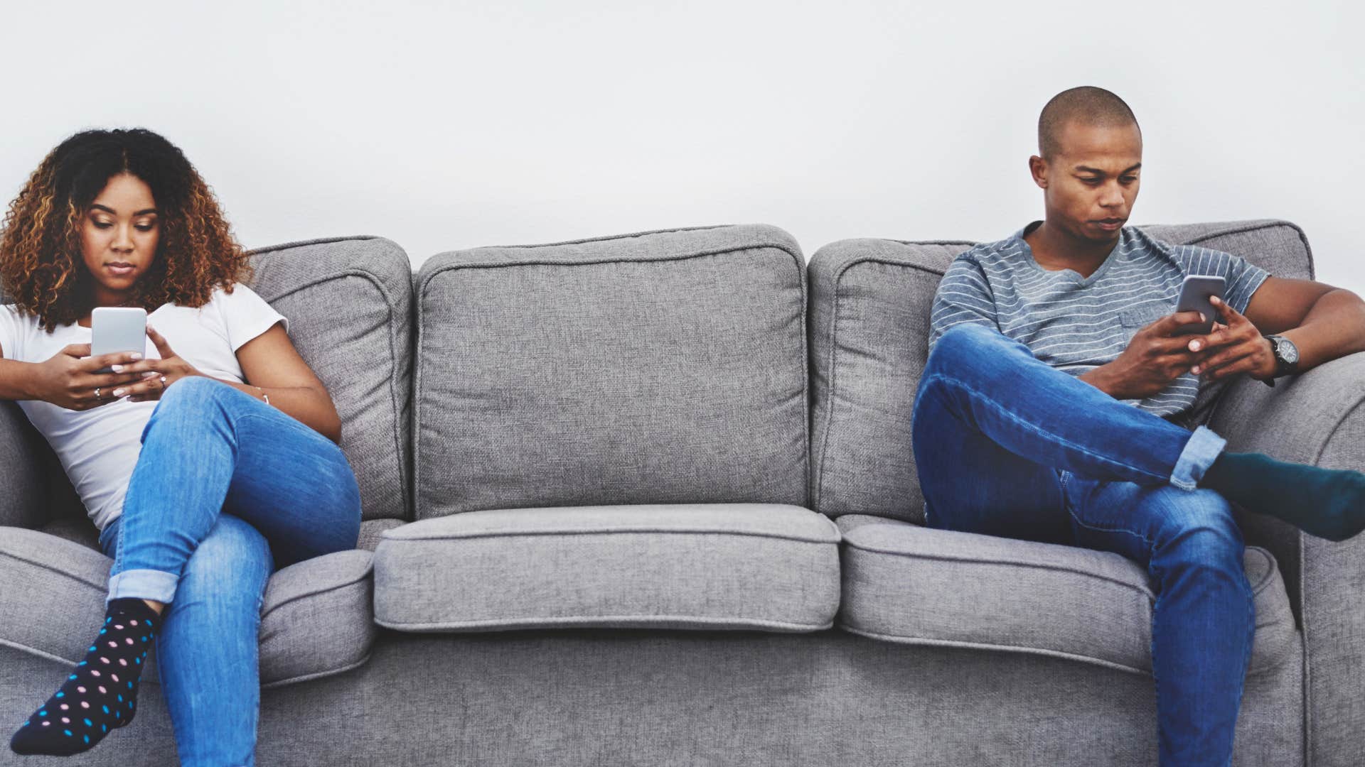 couple using phones as an escape from each other