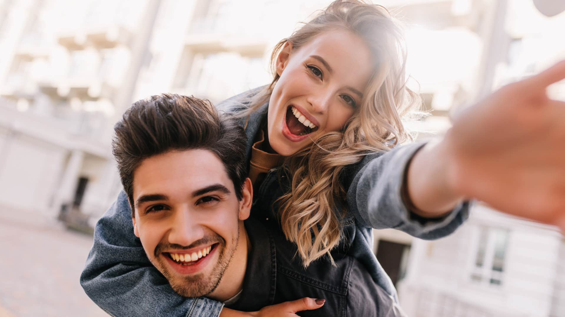 couple having fun while taking selfie