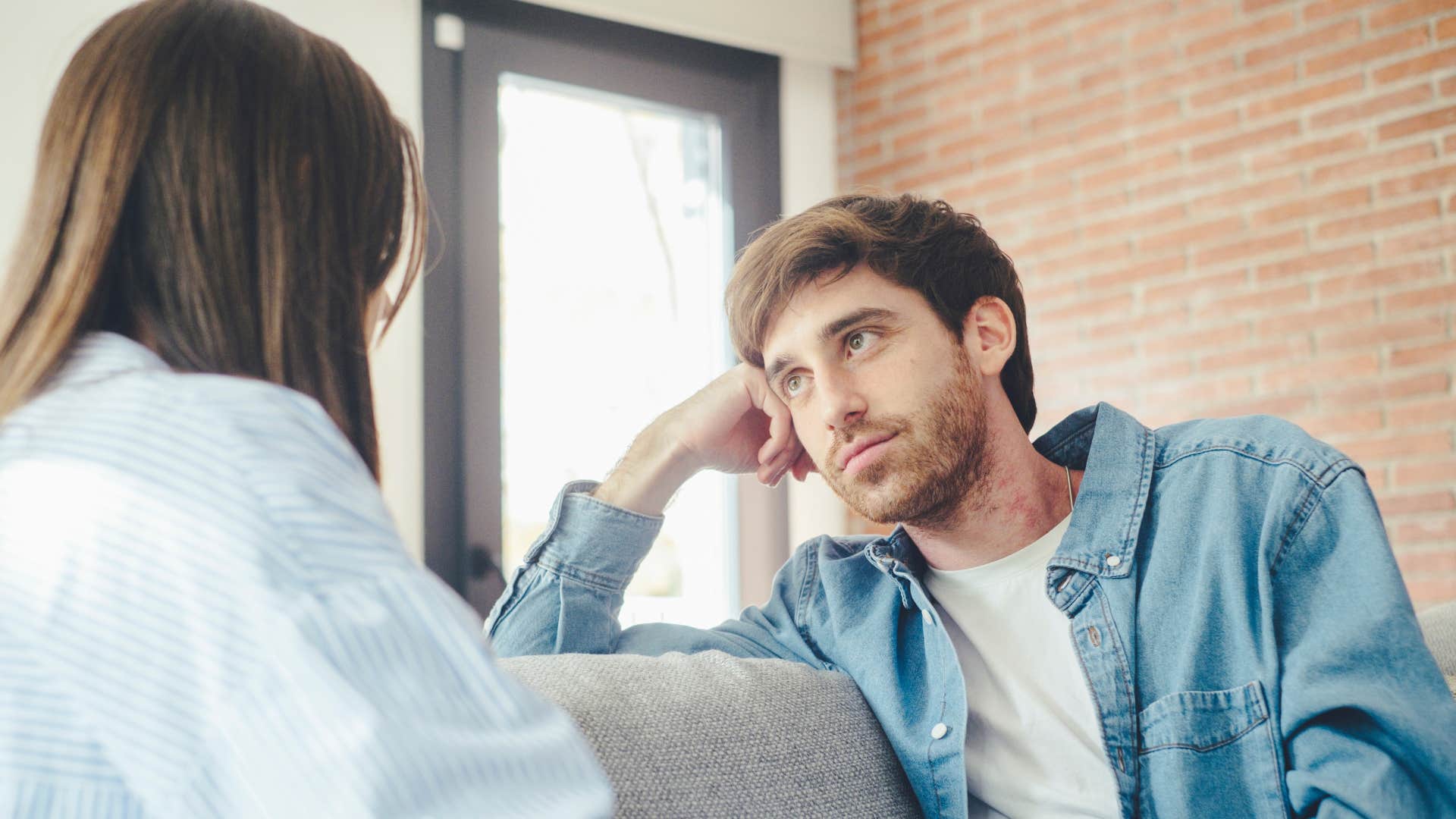 man listening intently to wife speak