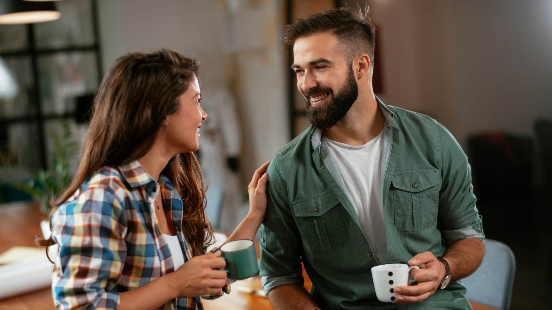 man treating female co-worker equally over coffee
