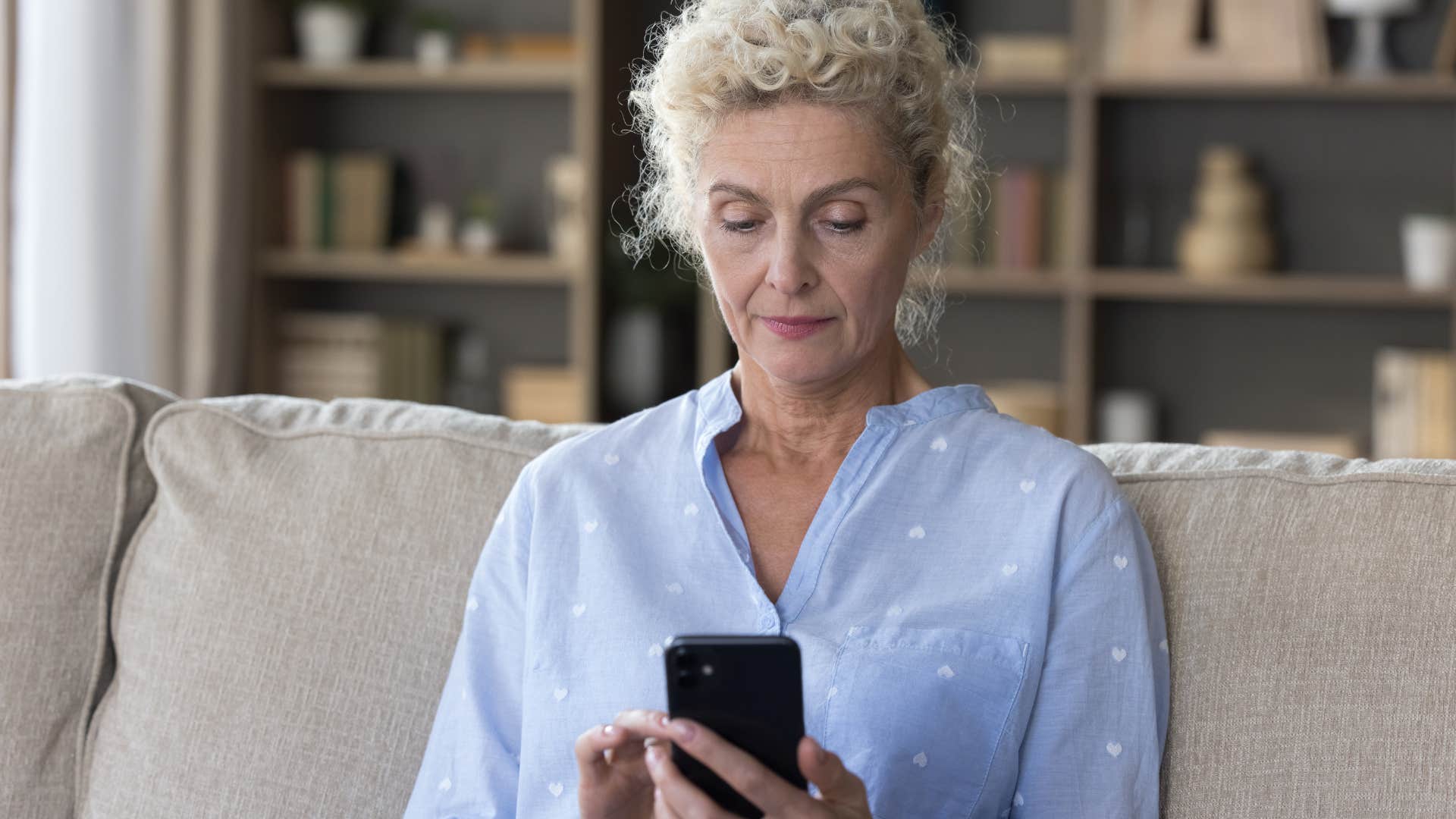 woman on phone worried about wasting time