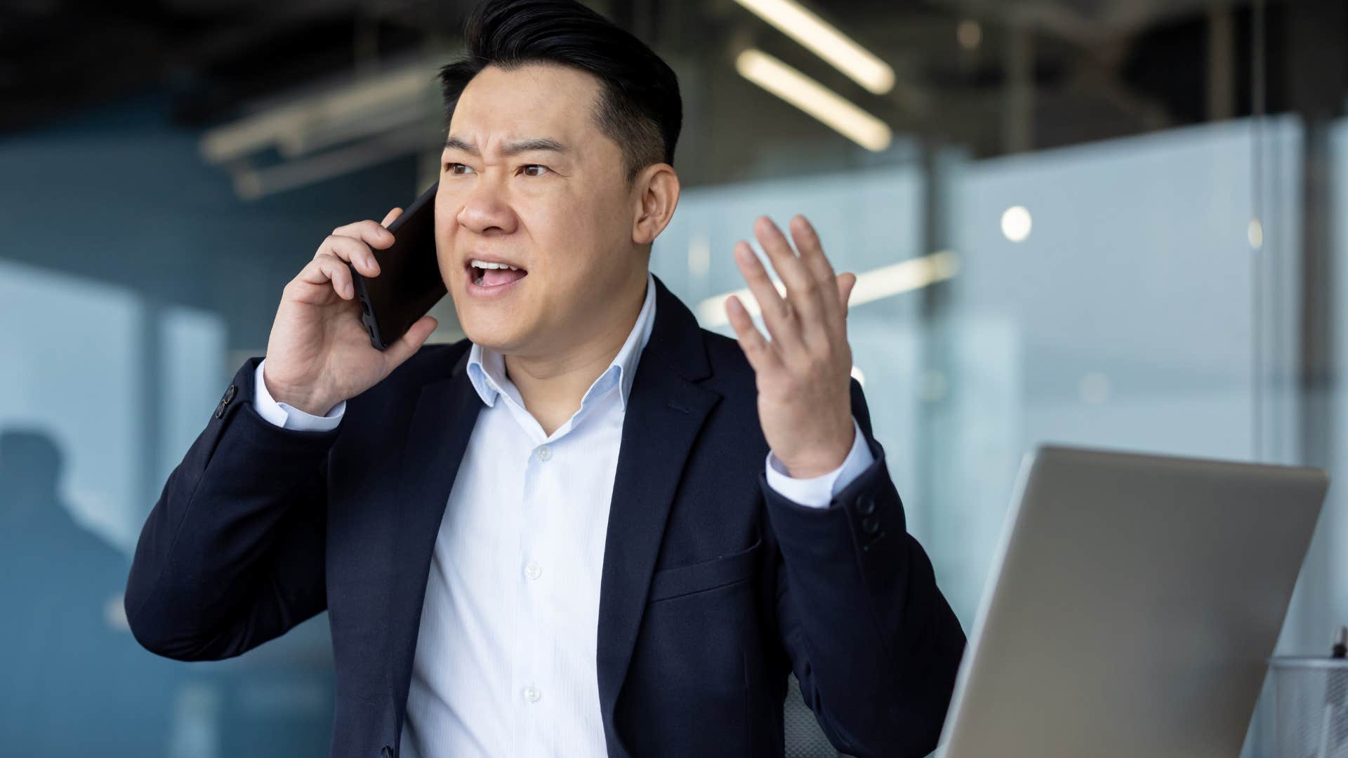 angry man on the phone saying that's not my problem