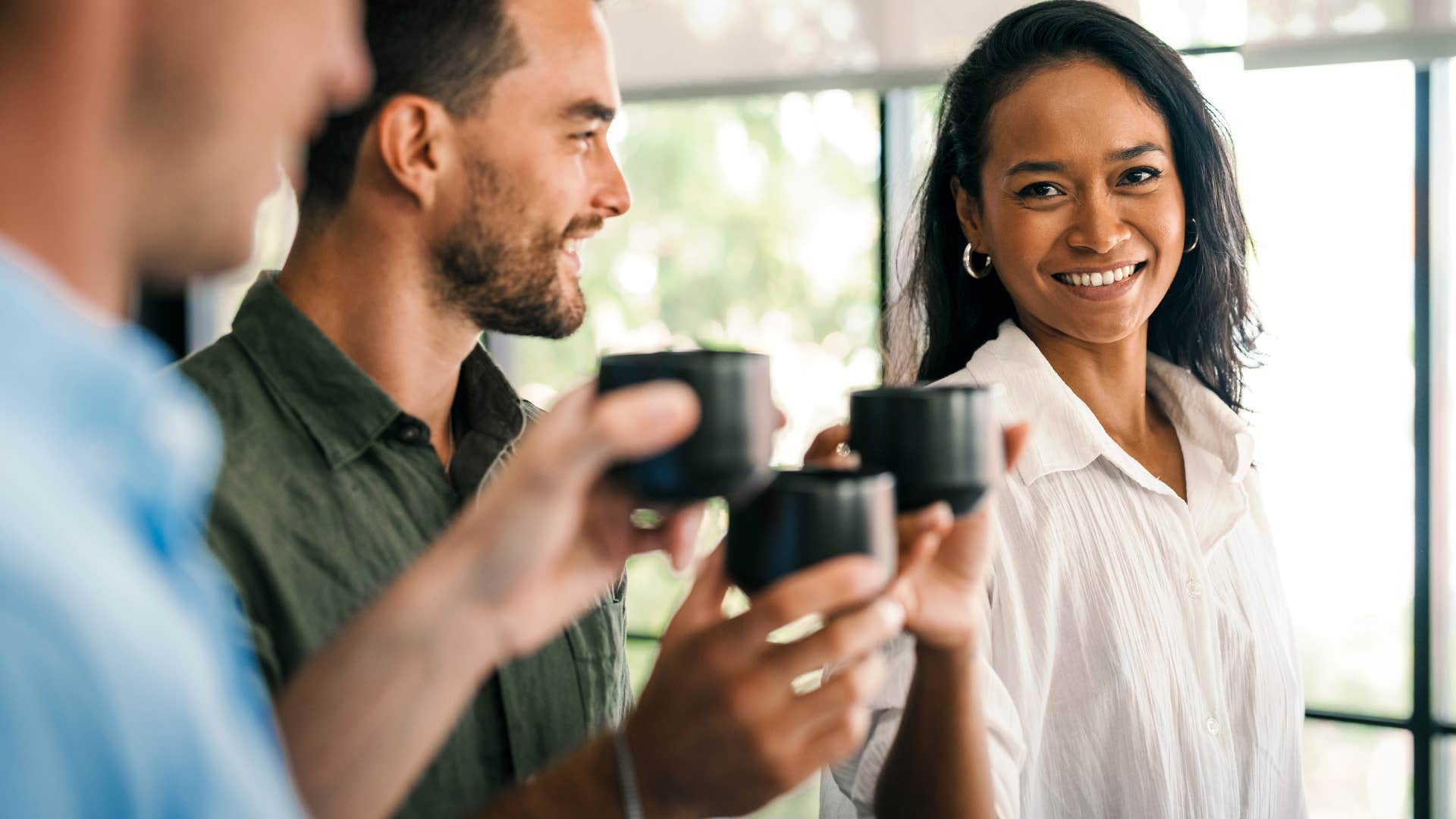 professional woman asking How can I help to her co-workers