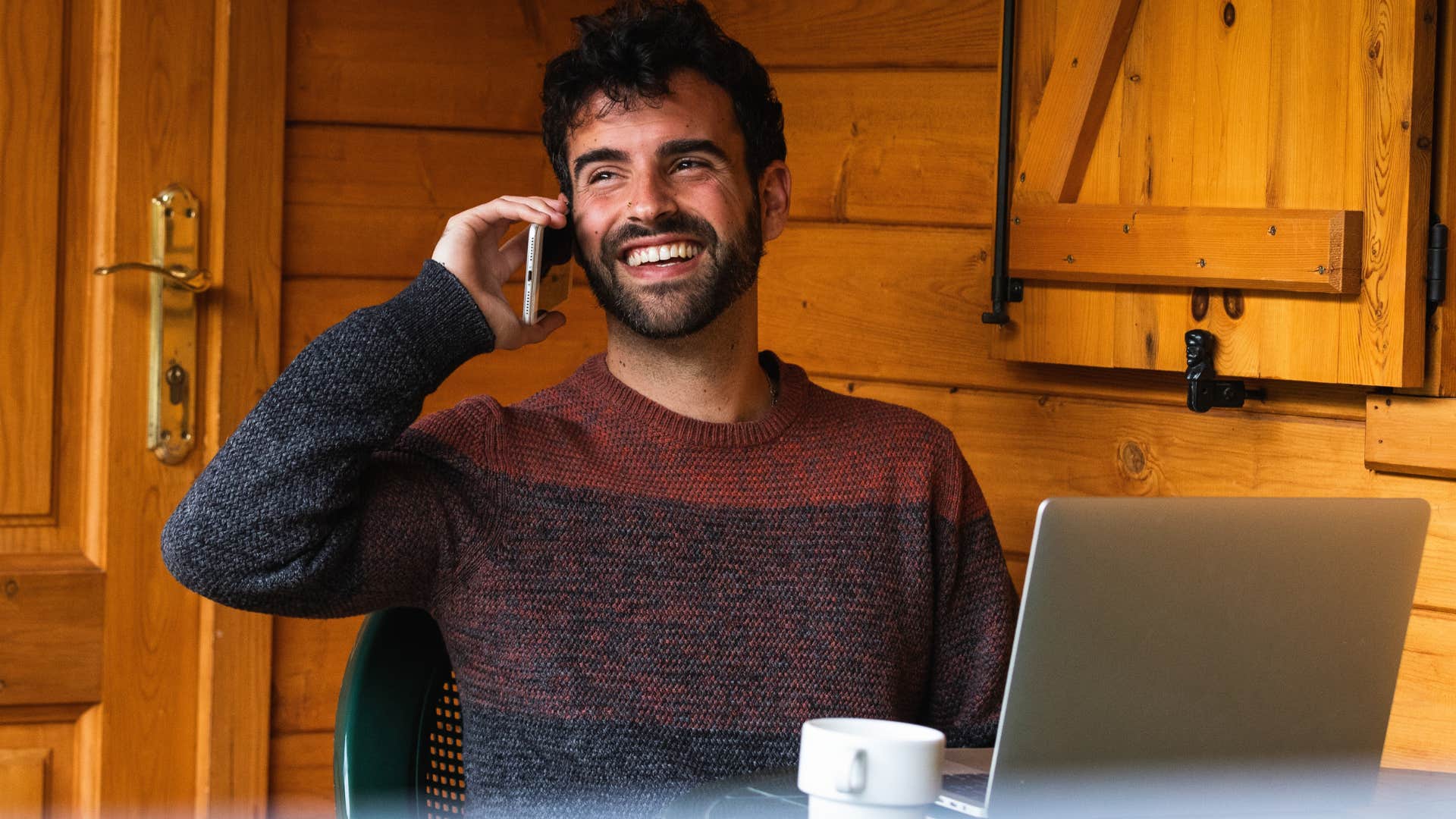 man talking on the phone saying I thought of you