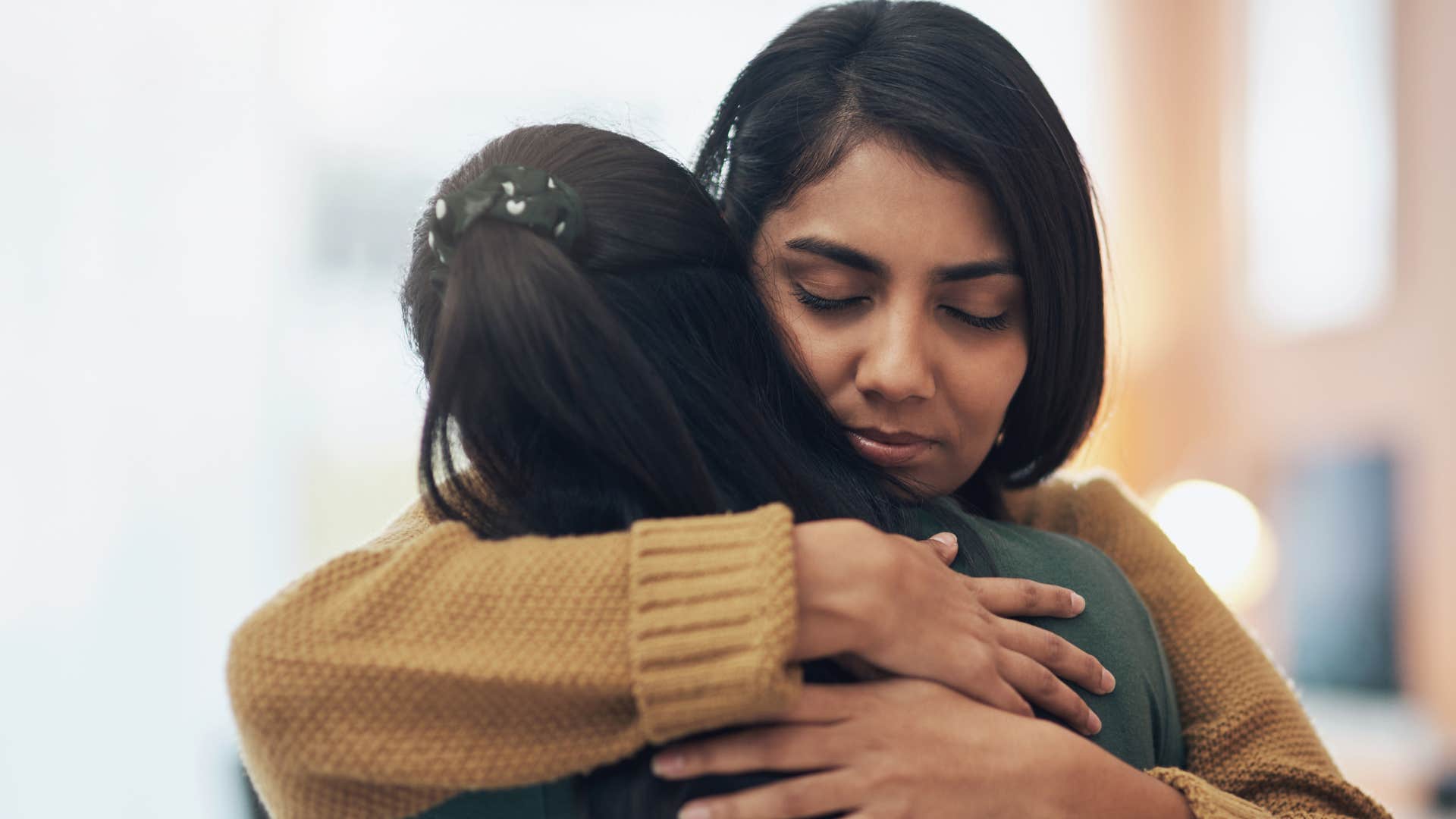 friends hugging nice woman telling her i'm always here for you