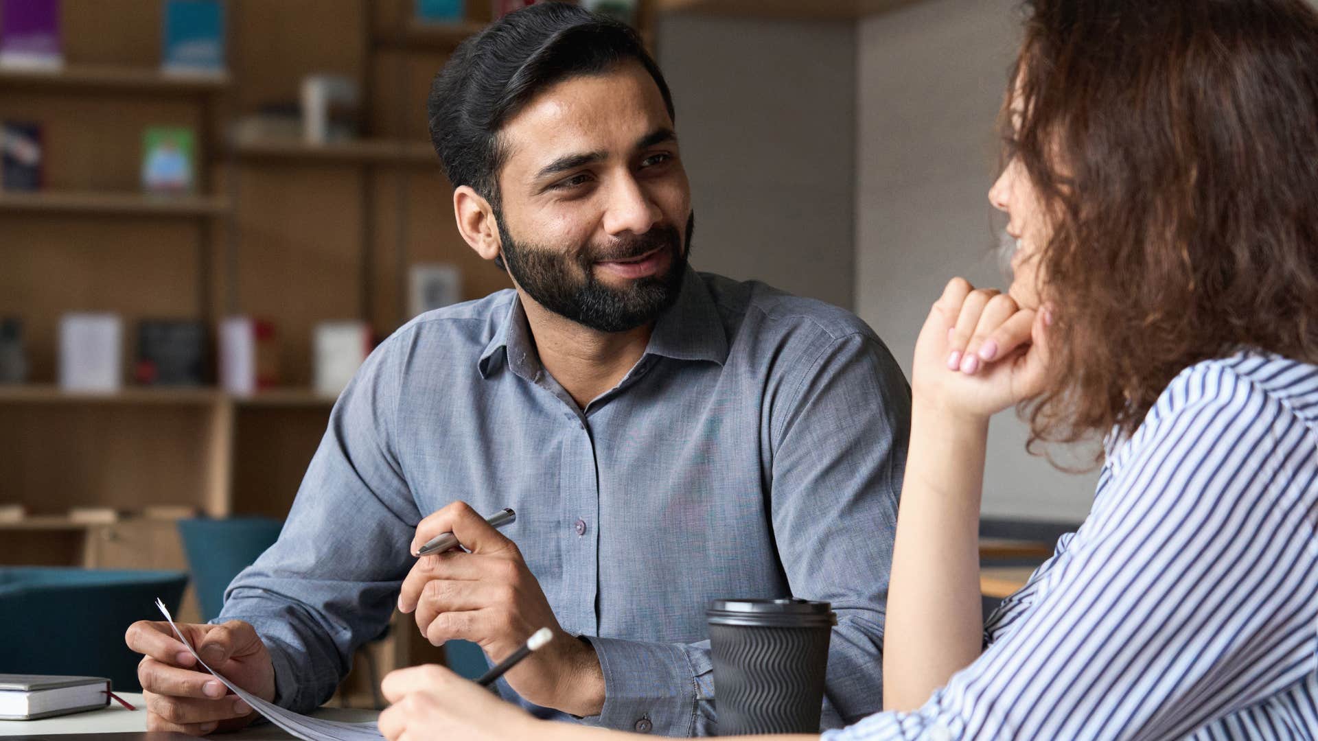 nice man saying it's no big deal don't worry to his peer