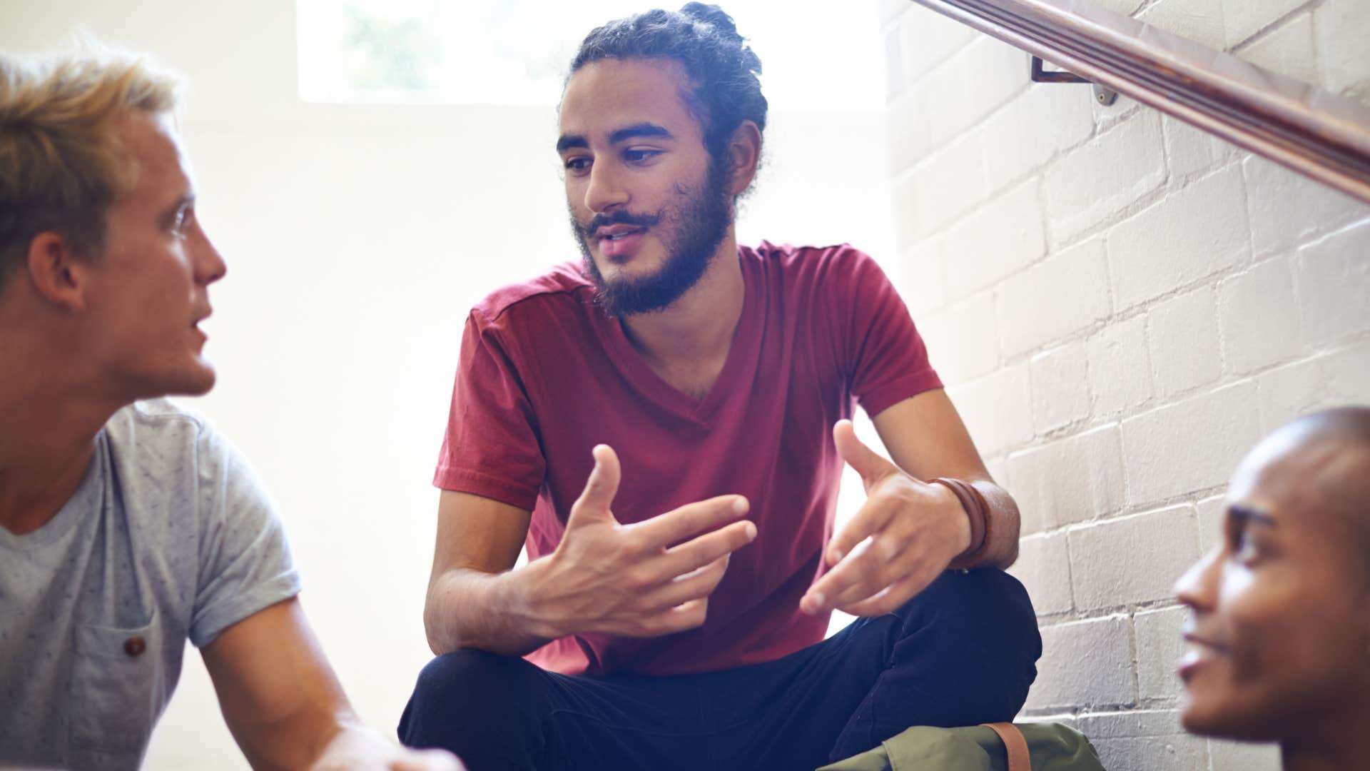 calm nice man saying take a break to his friends