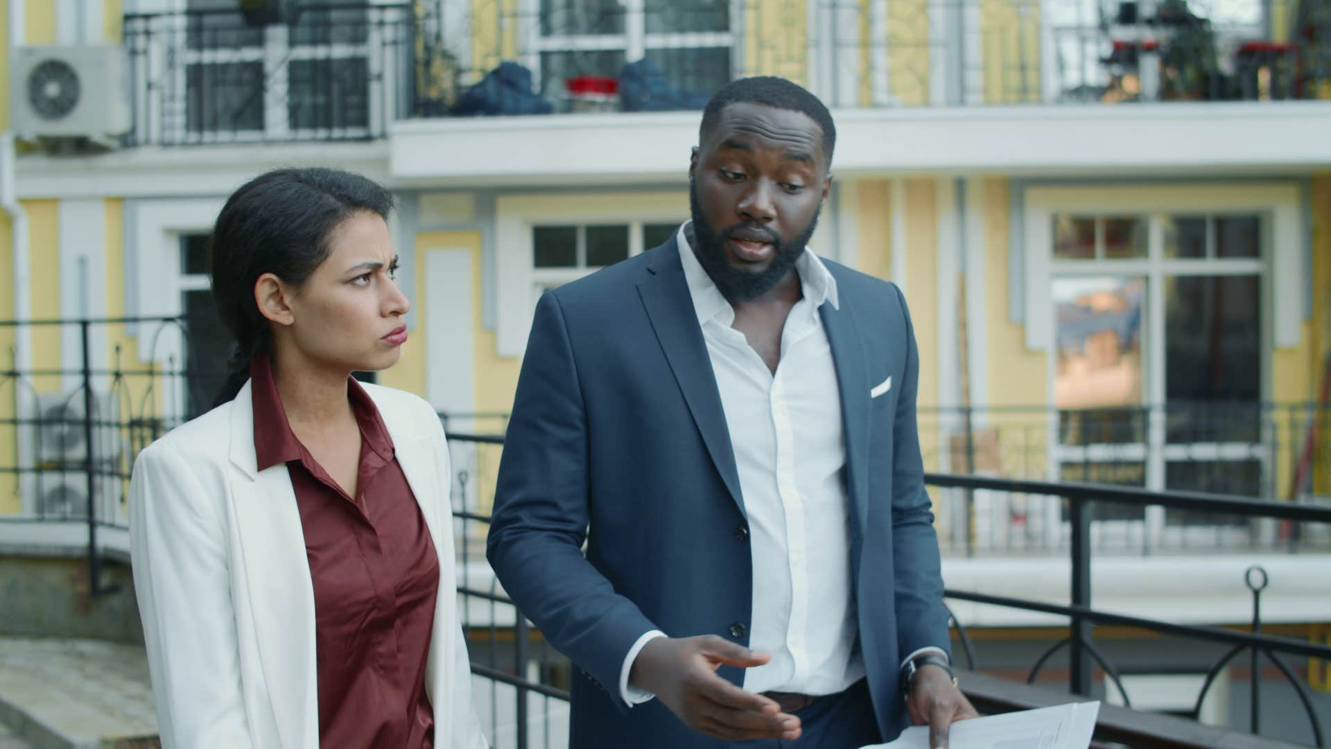 business people walking while talking outside