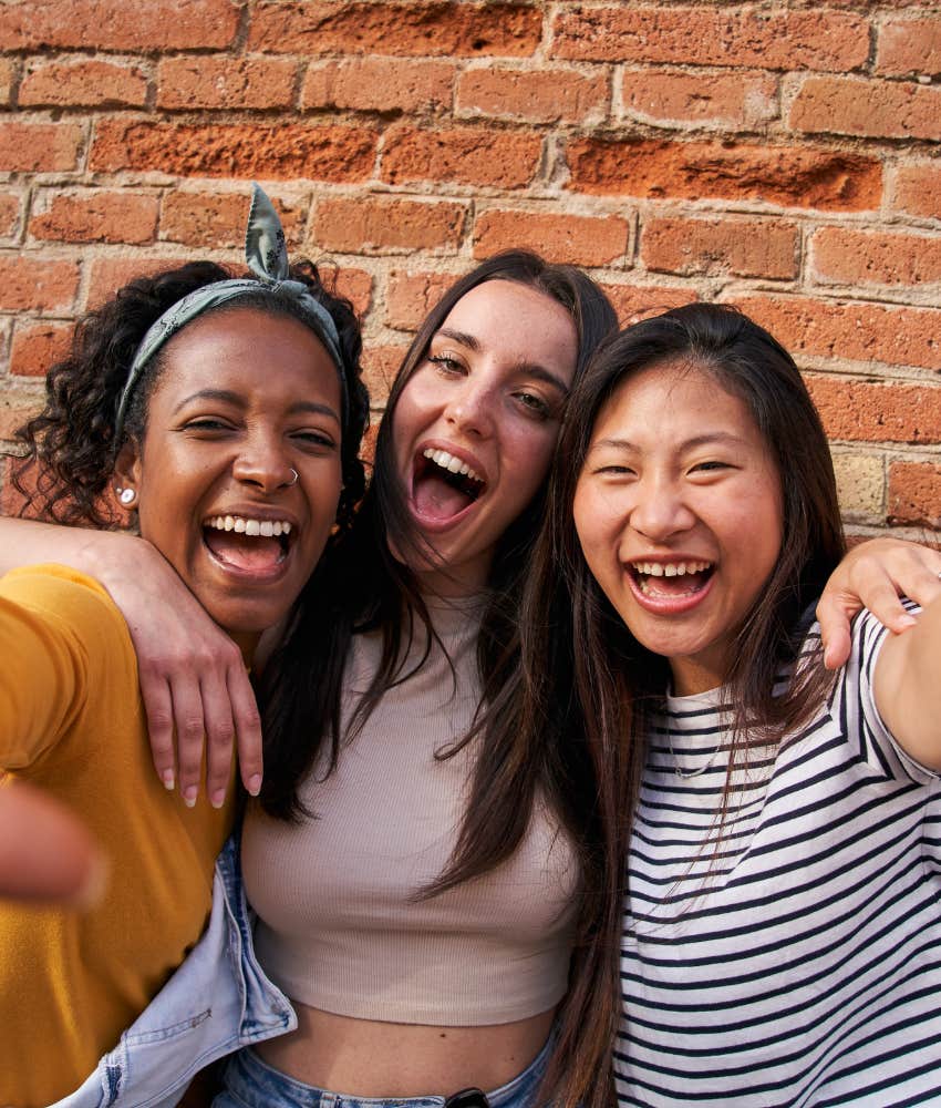 Happy friends embrace showing not changing if you are sensitive