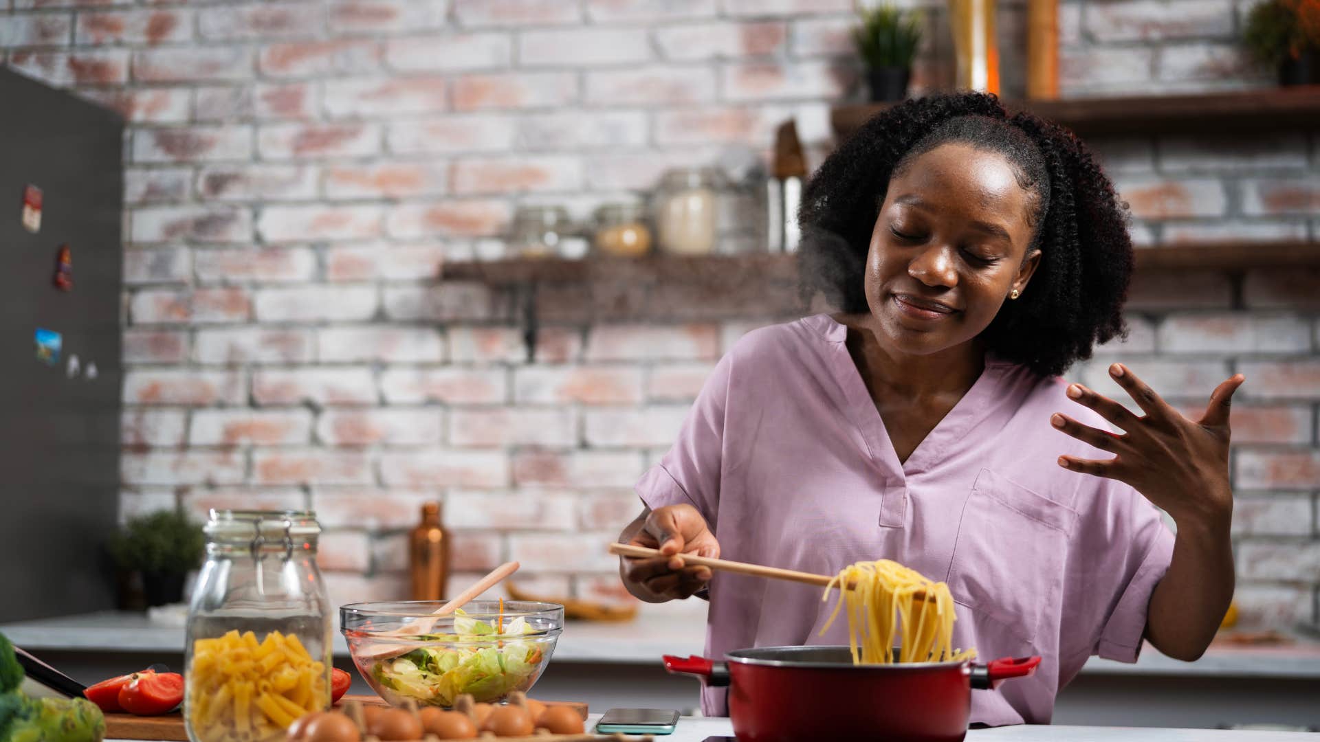 smiling woman cooking at home