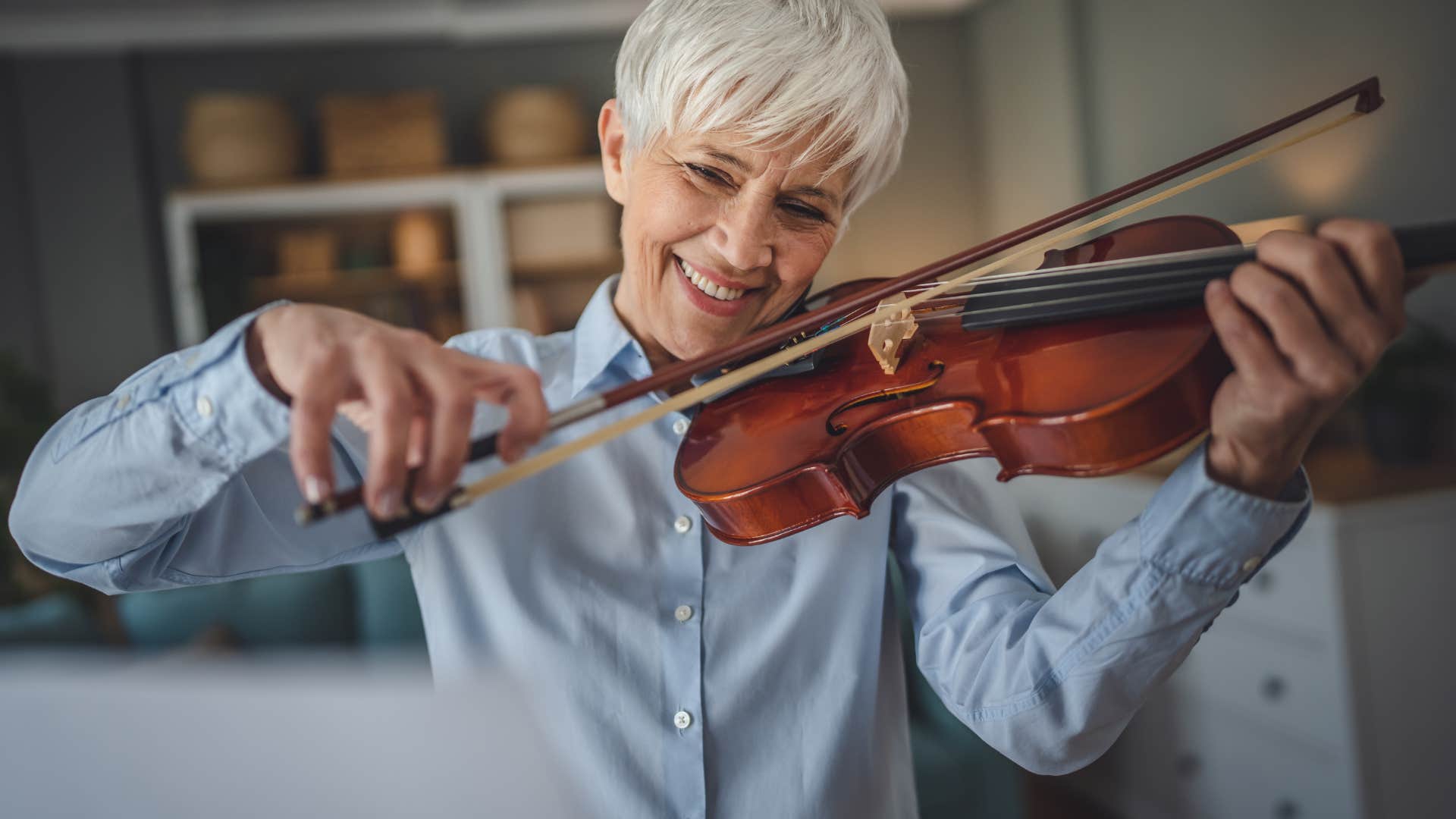 talented woman playing violin music