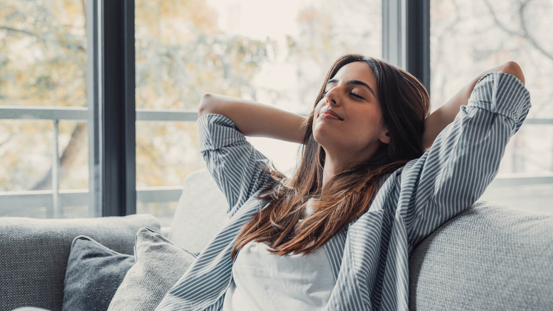woman relaxing on couch craving a sense of freedom