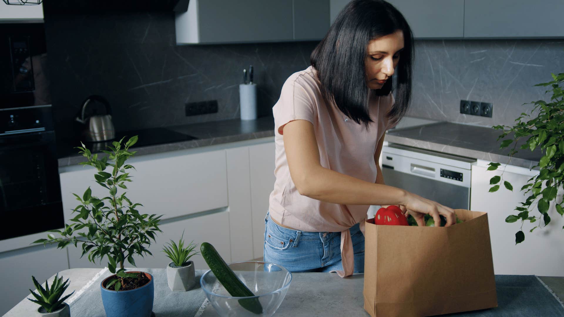 woman unpacking cheap groceries