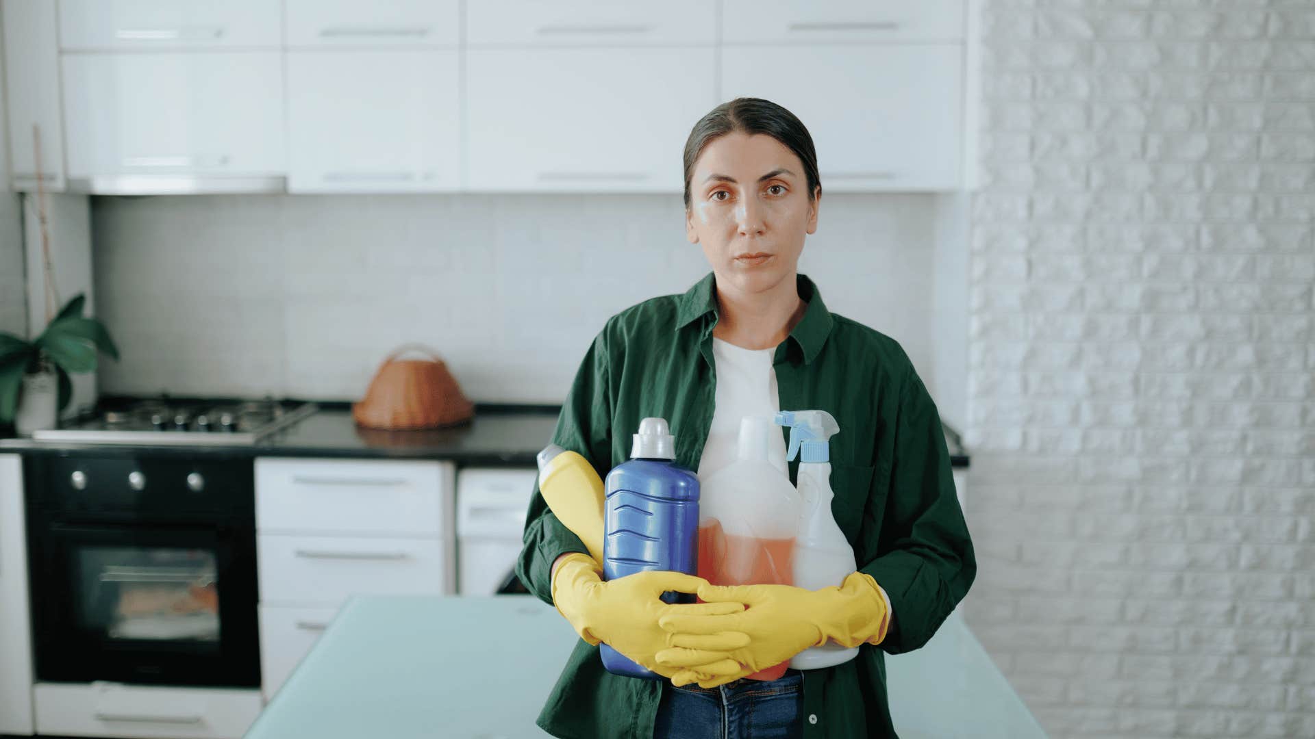 financially afraid woman holding diluted cleaning products