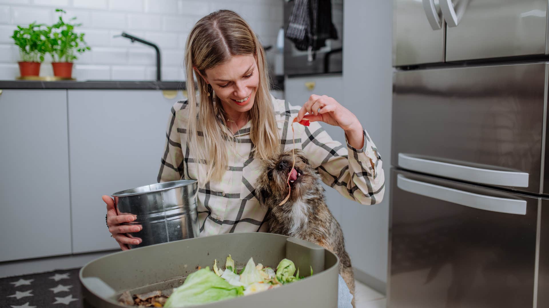 woman cooking food scraps for her and her dog