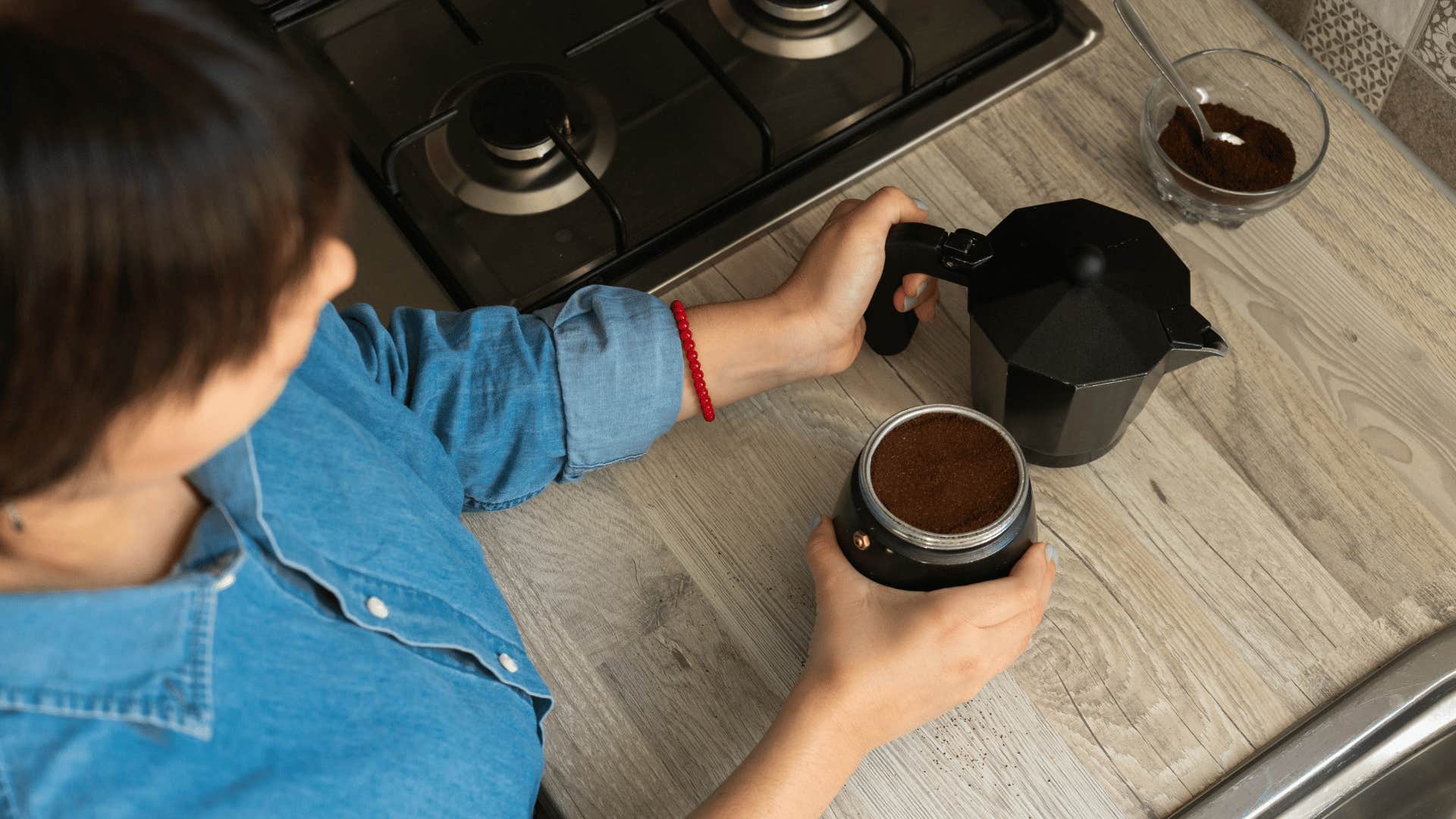 woman making instant coffee at home