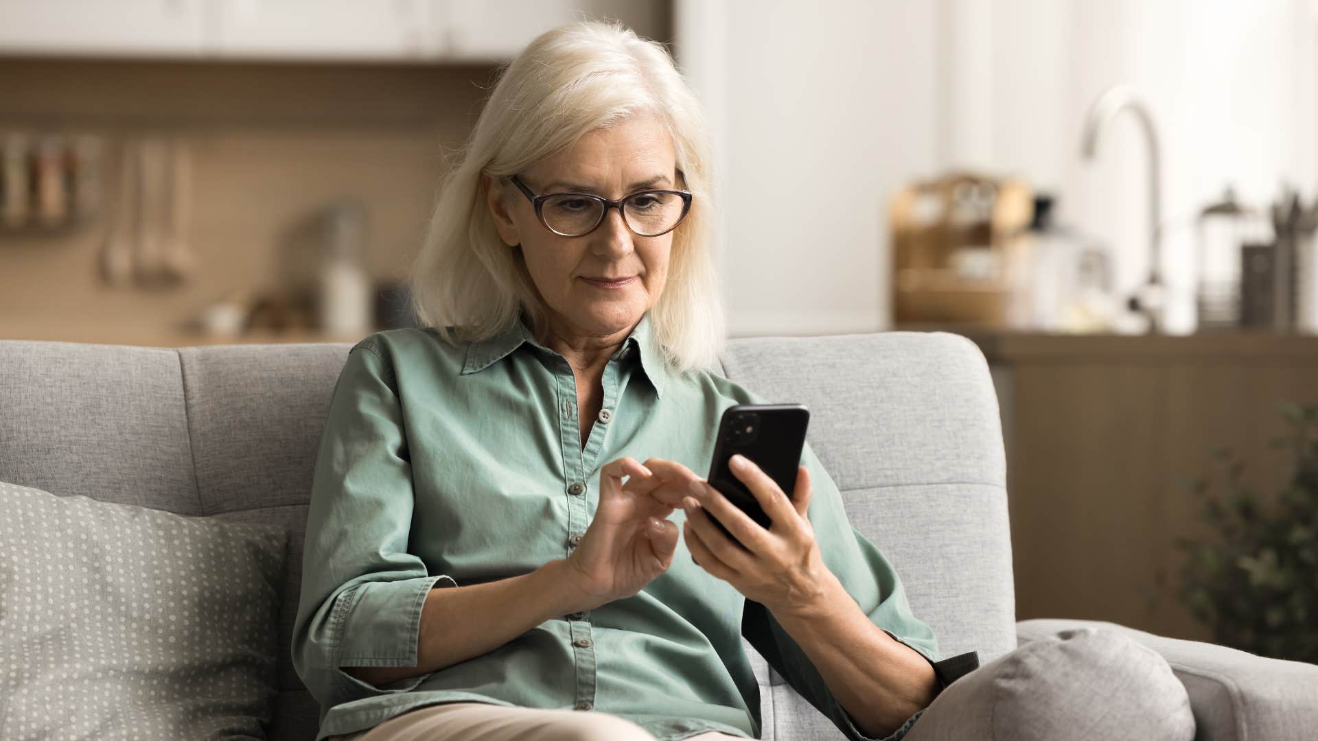 older woman texting her favorite child