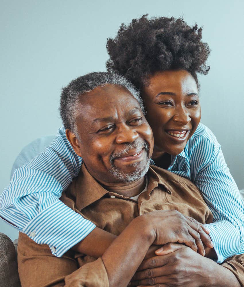 Happy person hugs trusted elder showing meaningful life