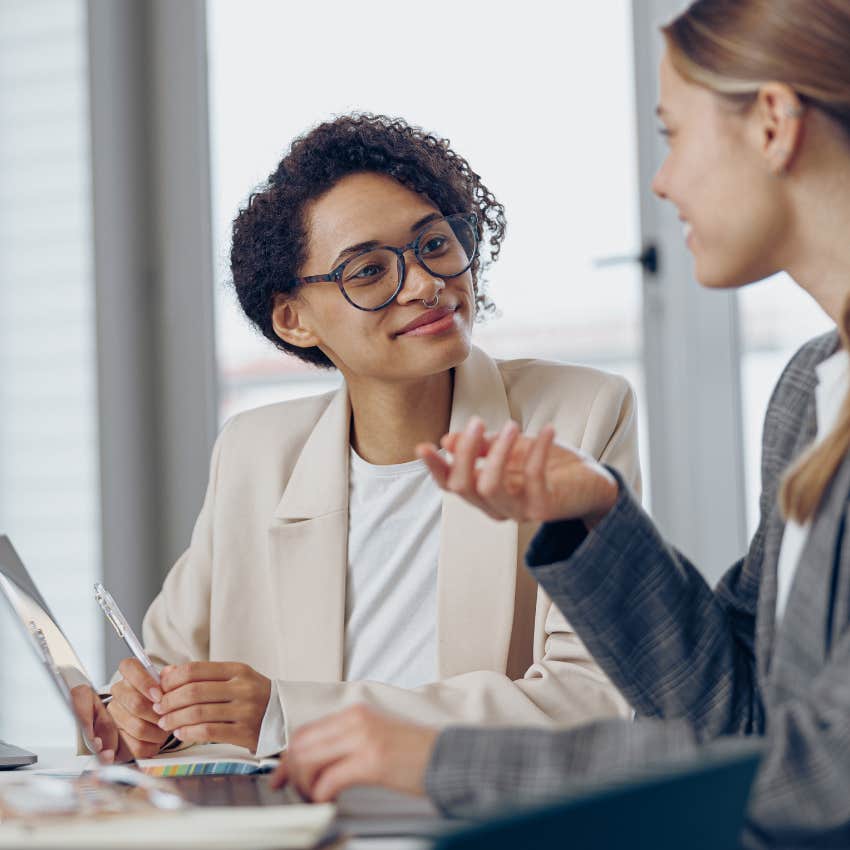 woman admitting she doesn't know something to her colleague