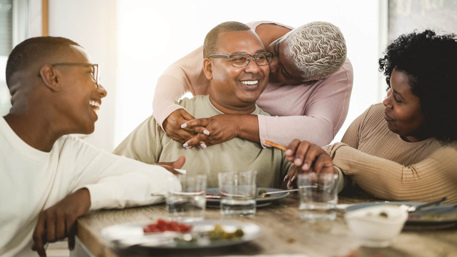 father sitting at the table during casual evening with family