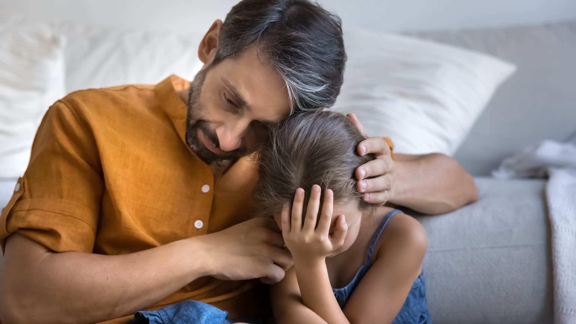 dad comforting daughter during hard conversation