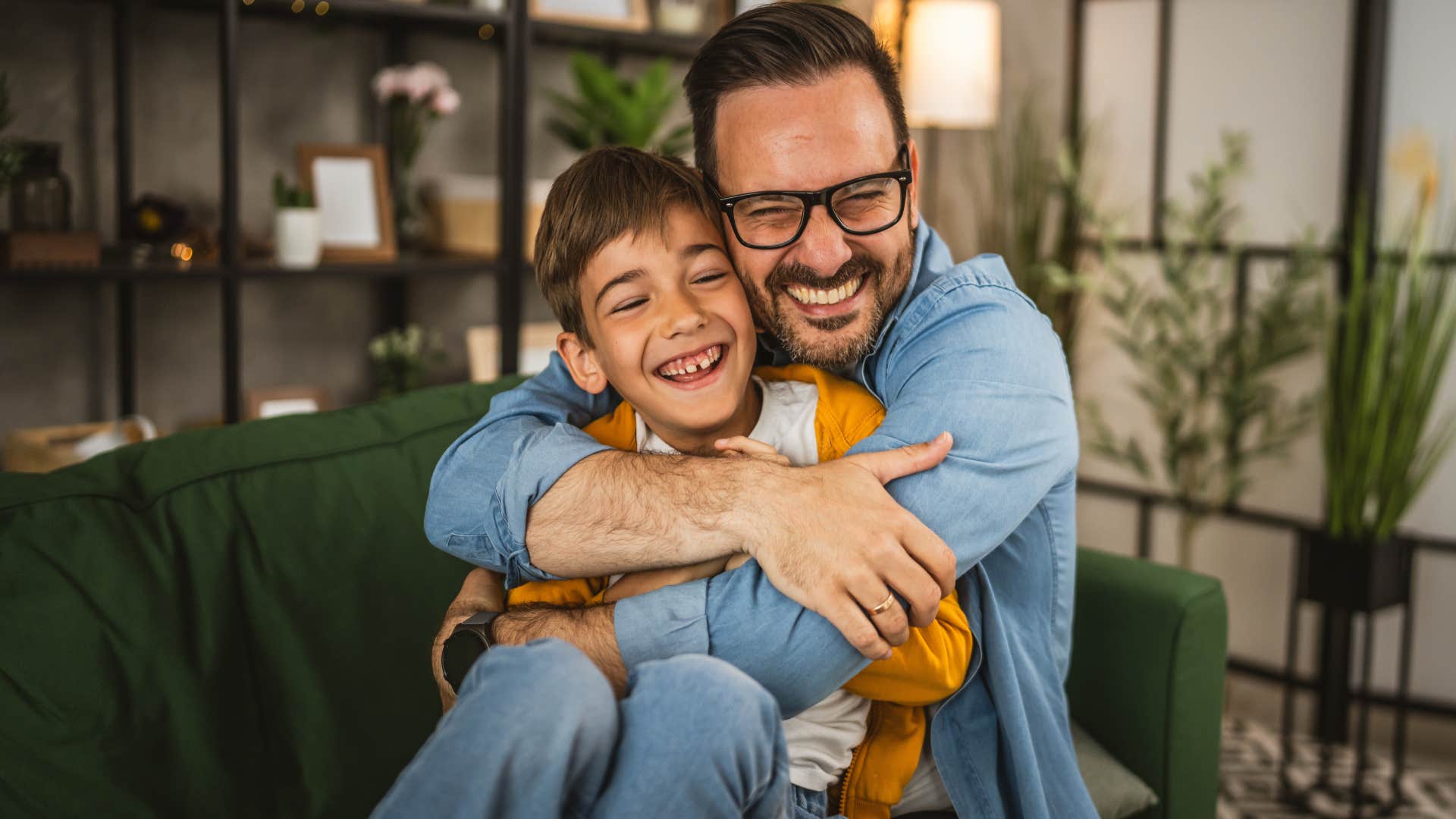 father and son hugging at home