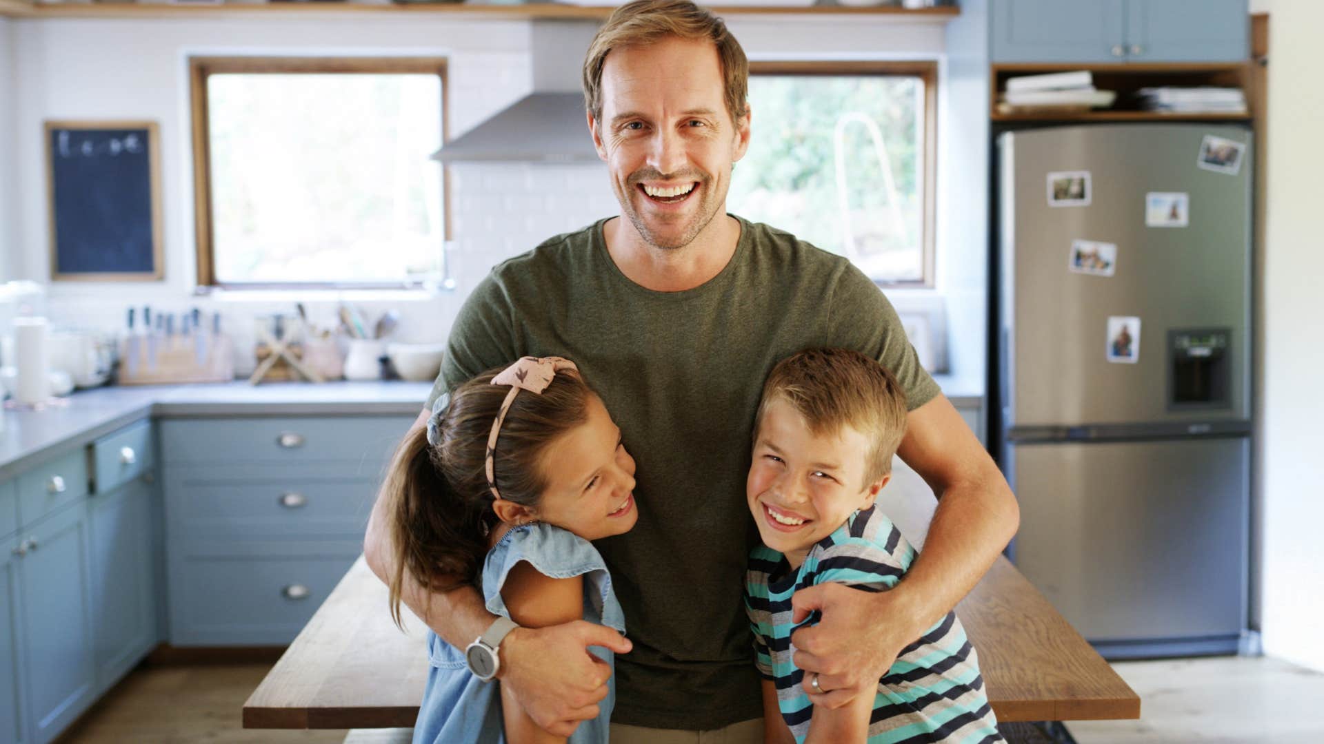 father coming to save the day and smiling with his kids
