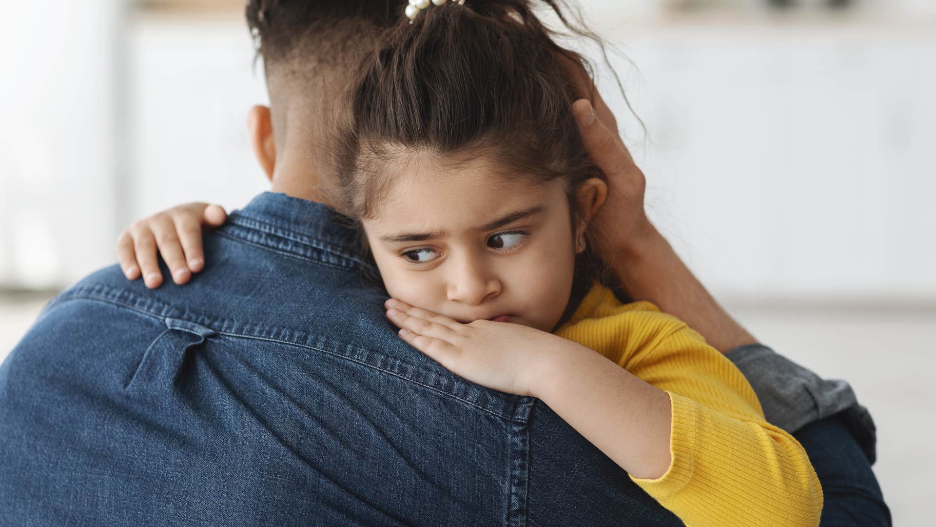 daughter hugging her dad when she was scared