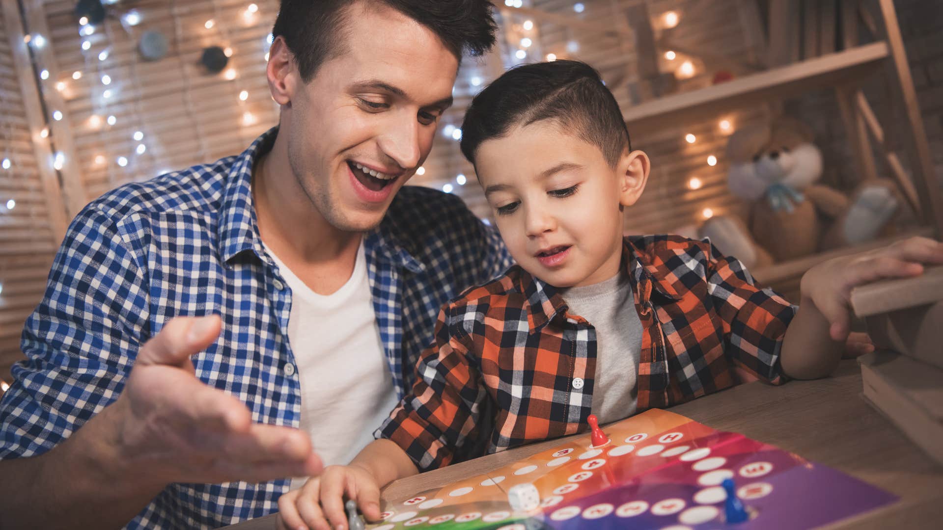 dad playing board games with son