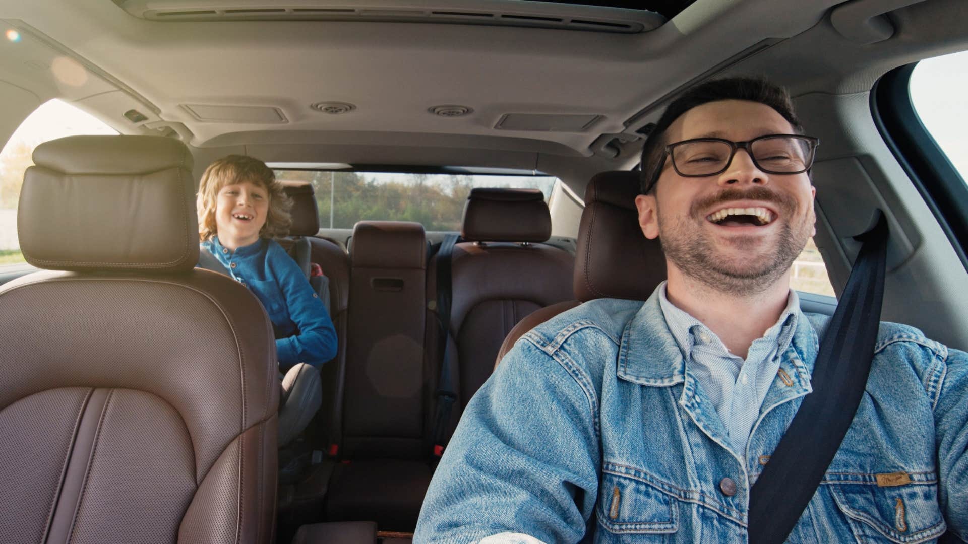 dad in the car with his son