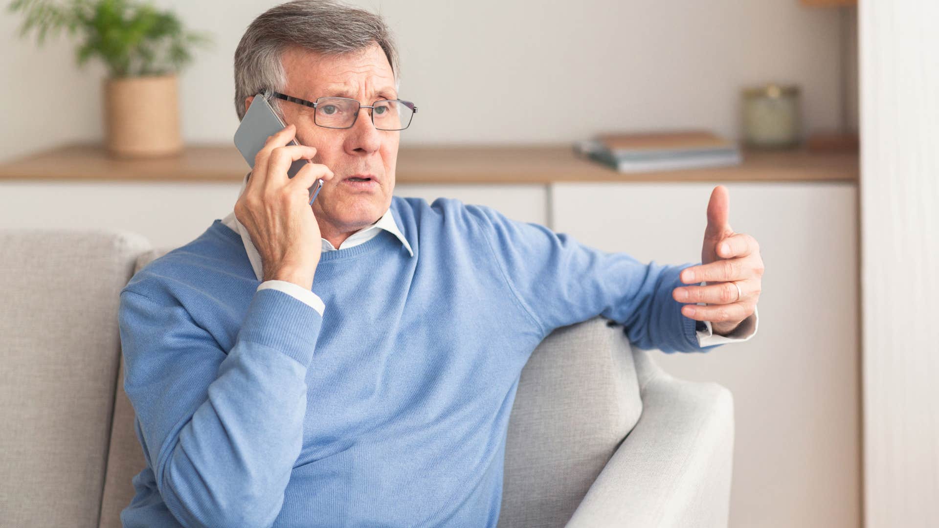 older father on the phone offering help to his kids