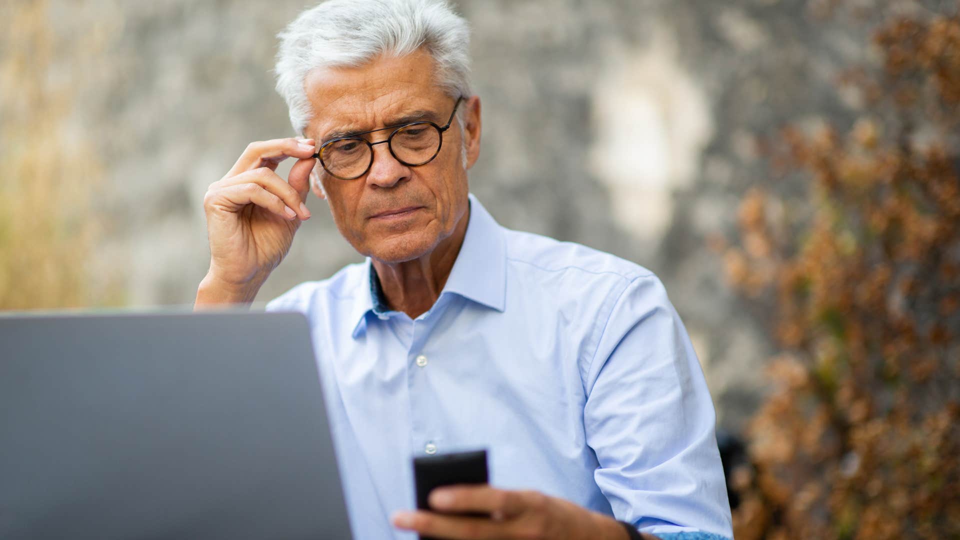 man checking in over text looking at phone