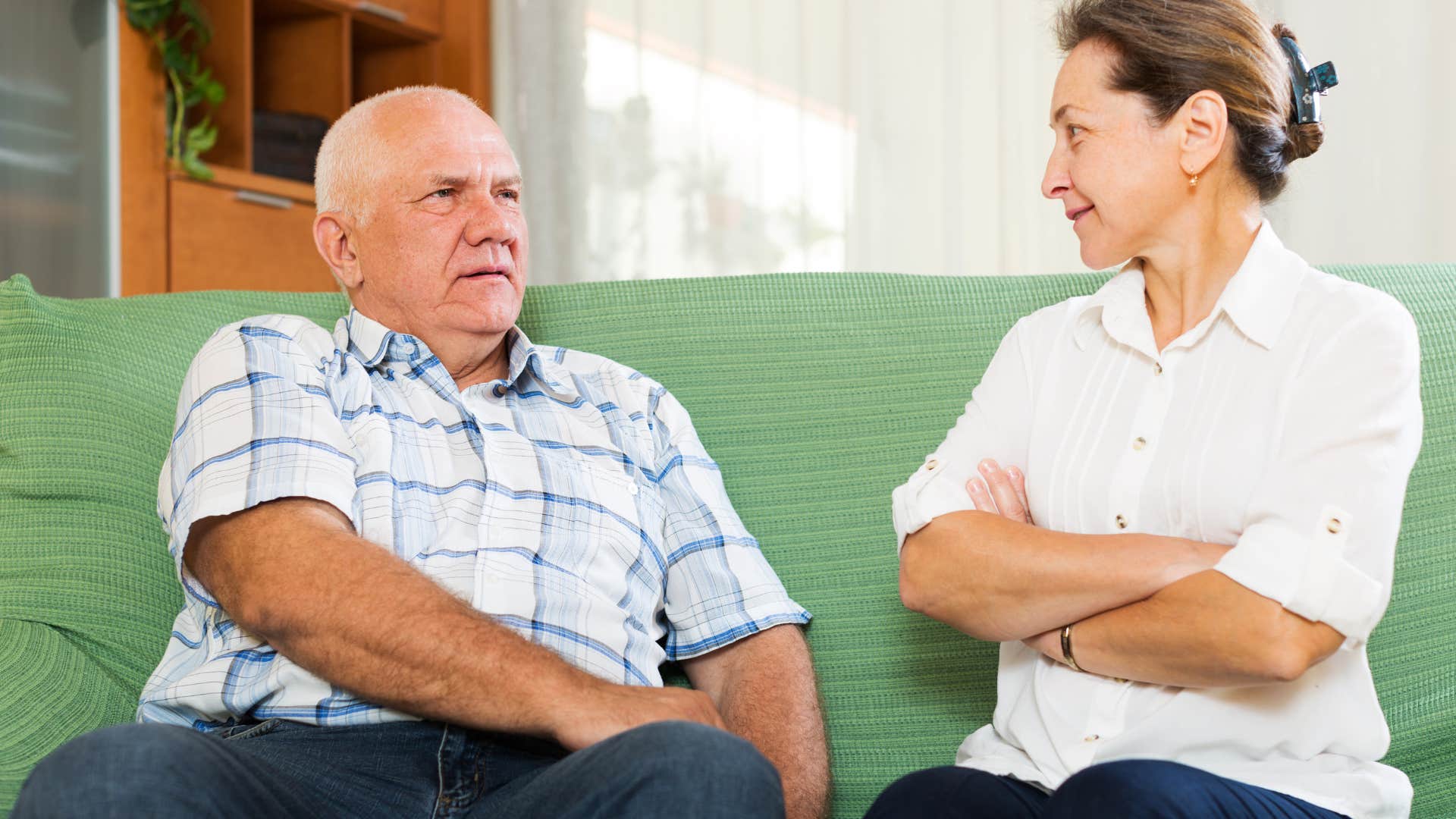 older man talking about the past with woman