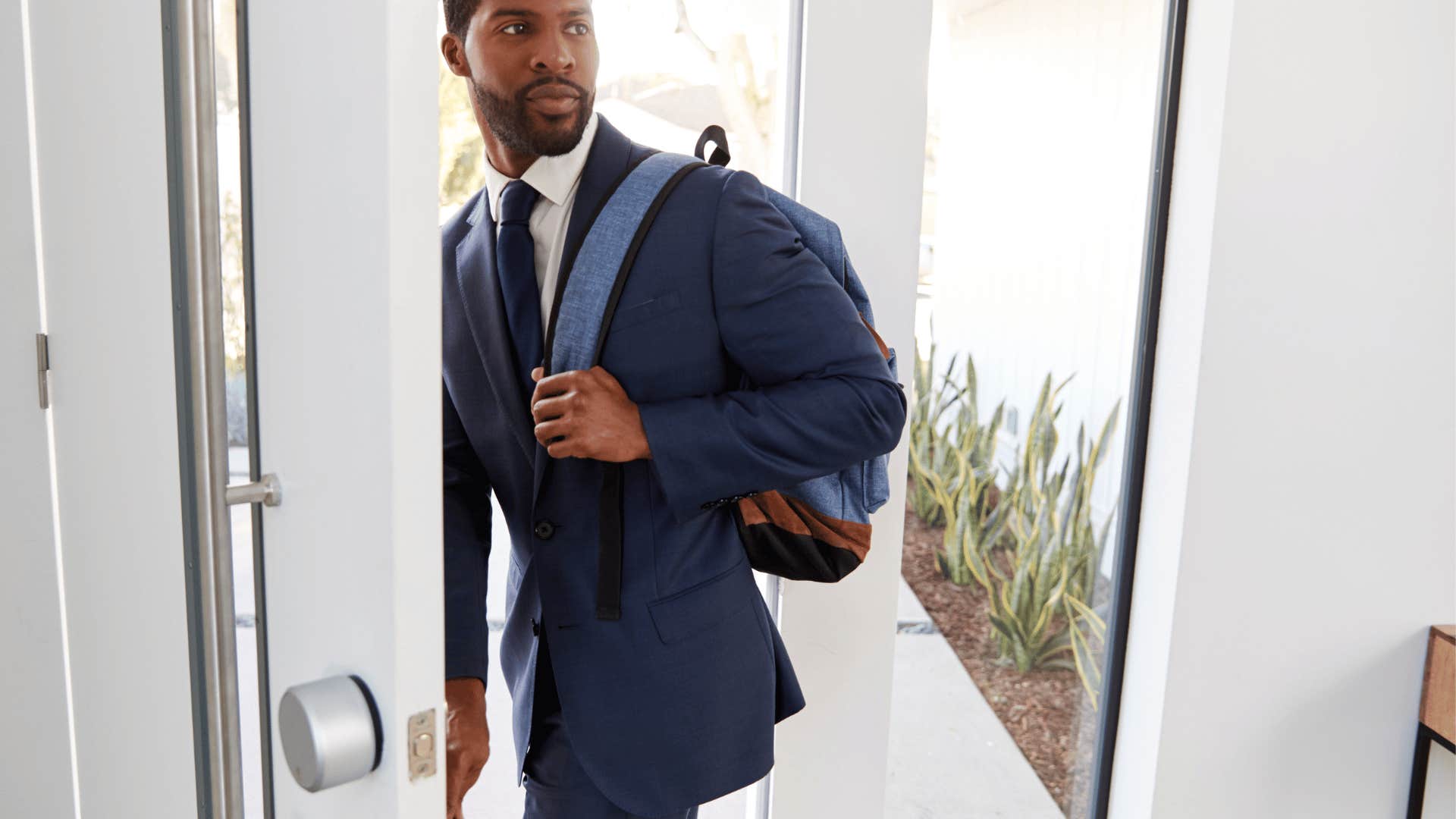 man leaving home abruptly in the morning